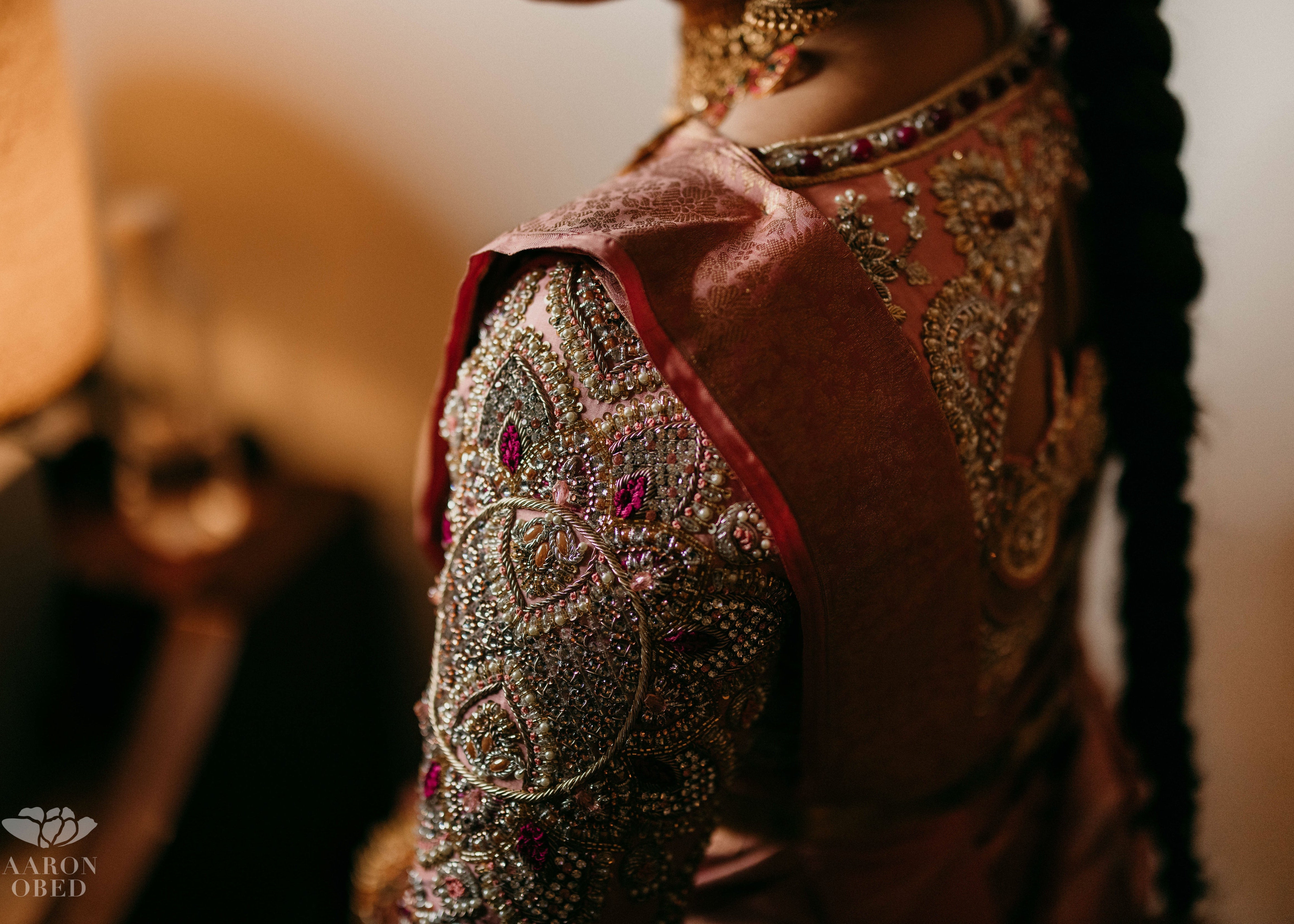 A palanquin concept pink blouse handcrafted intricately with resham knot work, cut dana, crystal, pearls, swarovski stones and sequins designed by Archana Karthick.