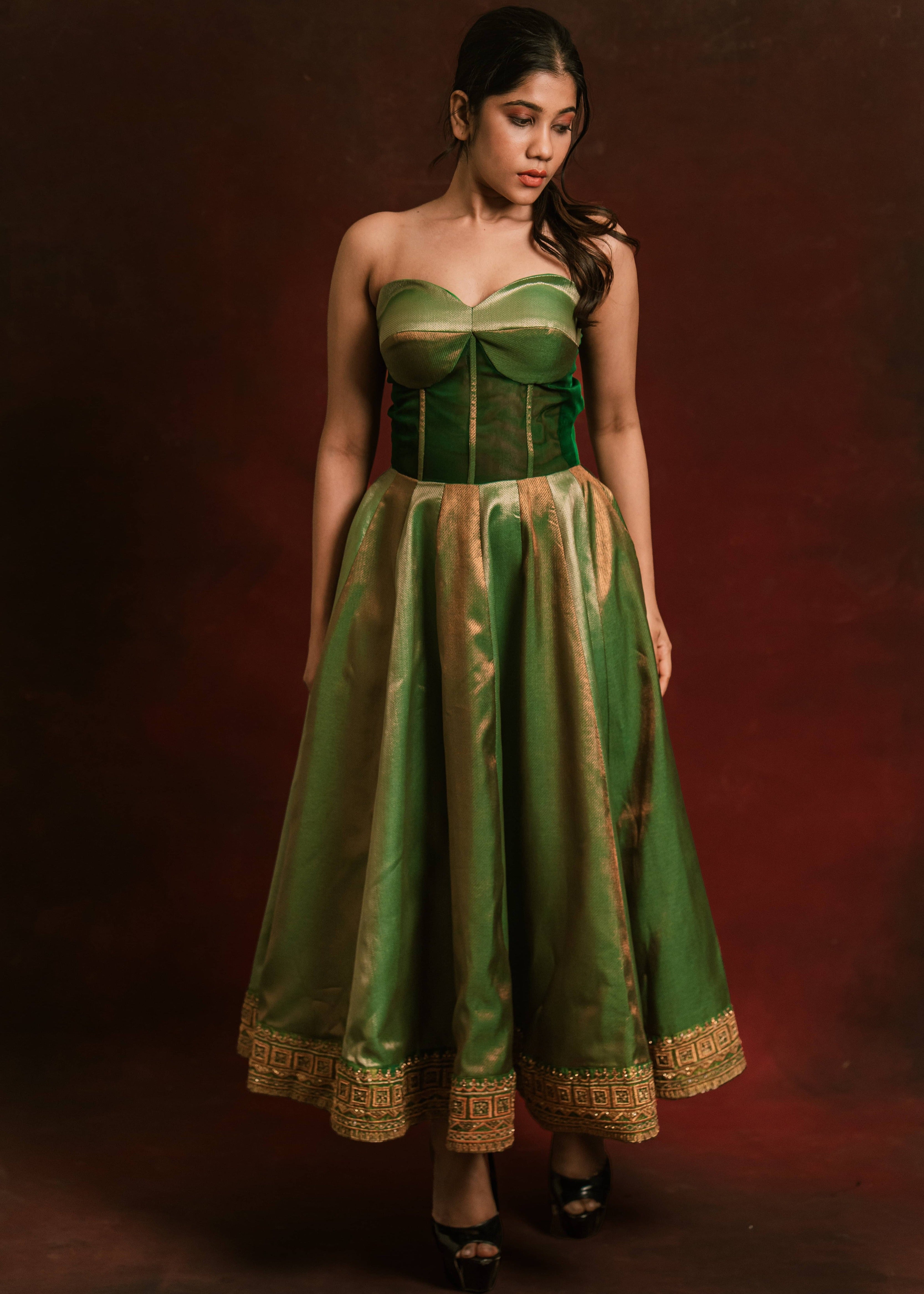 A silk corset designer dress intricately handcrafted with zari, gold beads, and antique cutdana by team Archana Karthick.
