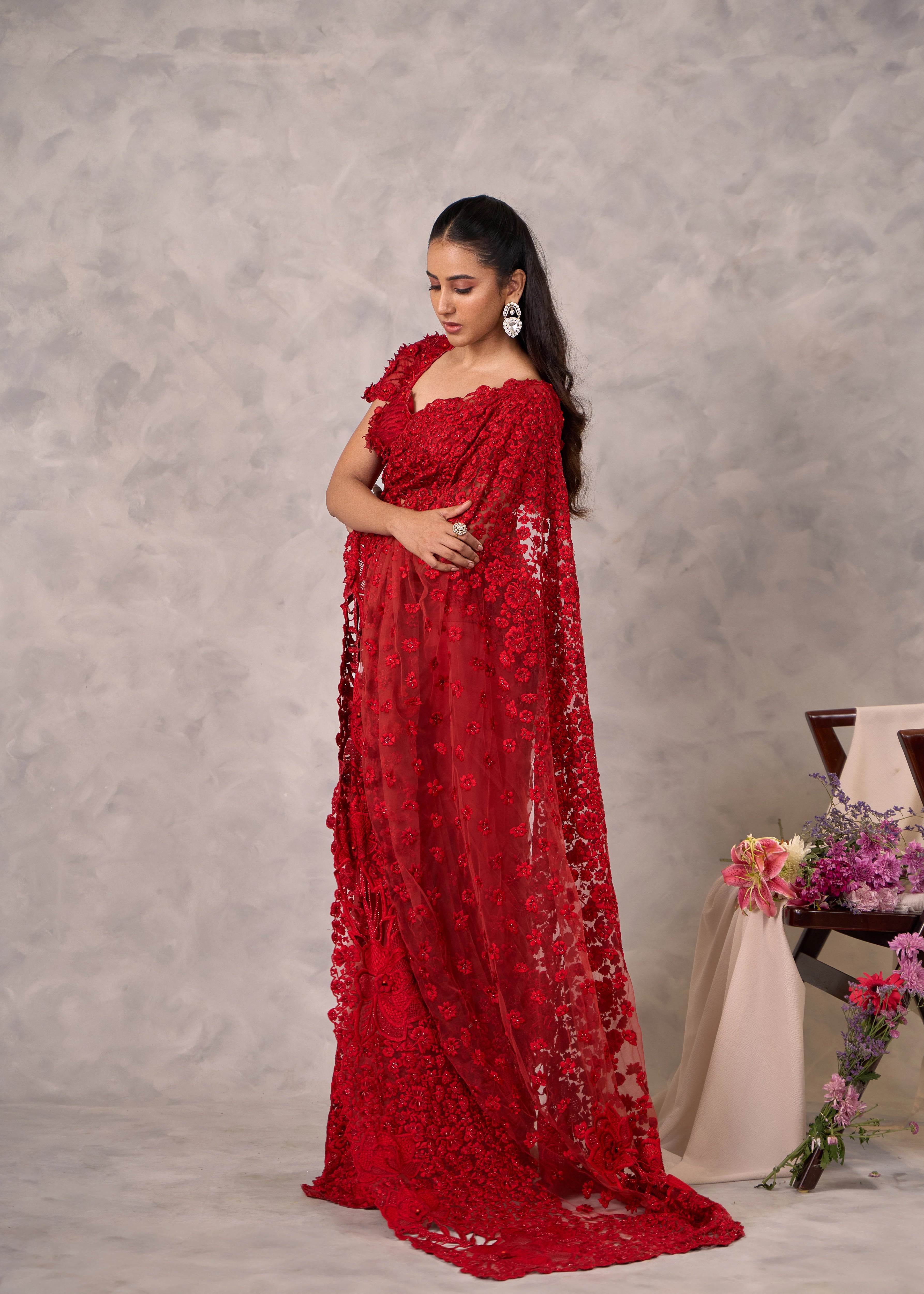 Actress Akshaya Hariharan looks gorgeous in red saree with floral motifs. Bridal & festive wear.