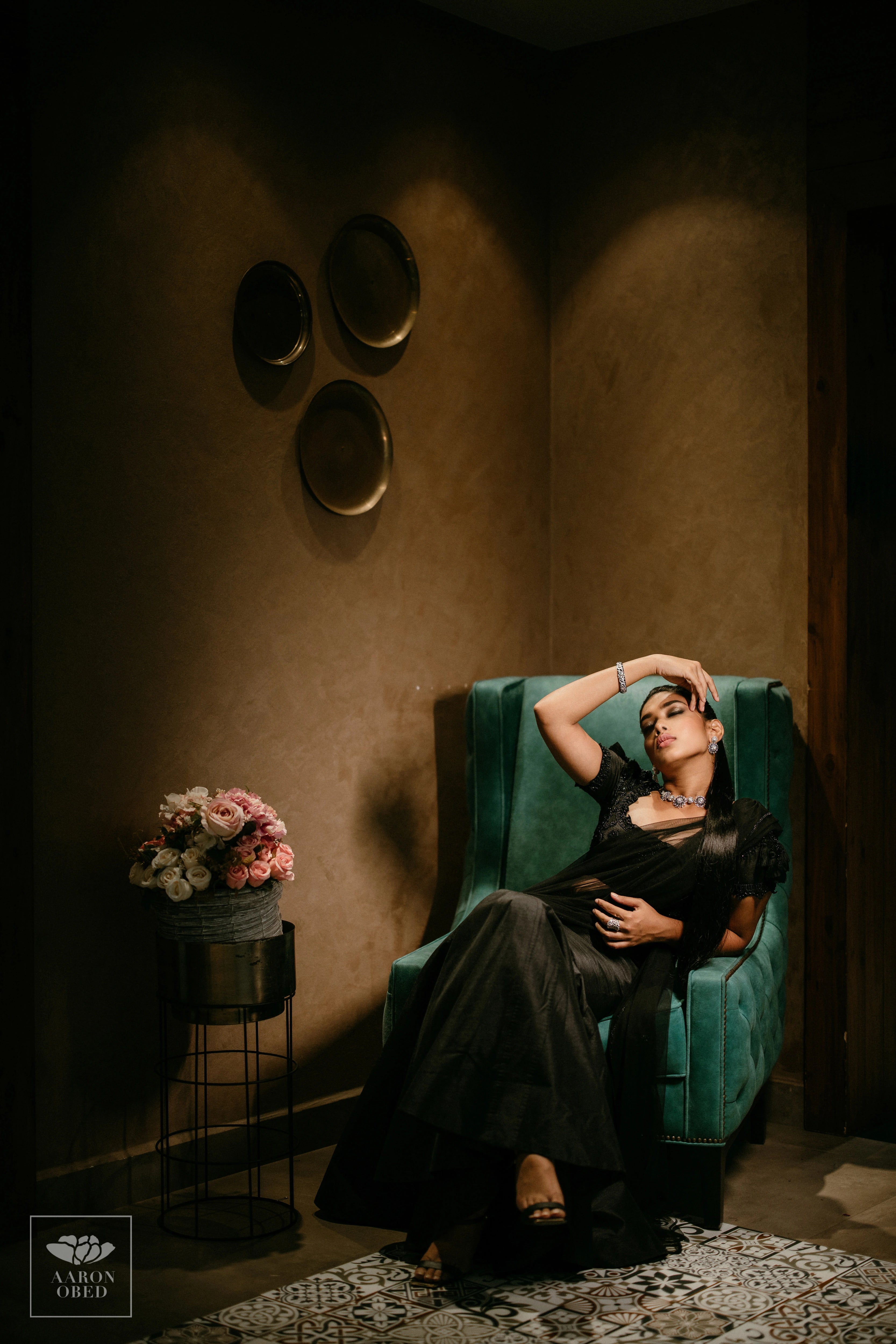 Actress Dushara Vijayan in a black tulle and raw silk draped mermaid lehenga, intricately handcrafted with beads, sequins and resham by team Archana Karthick.