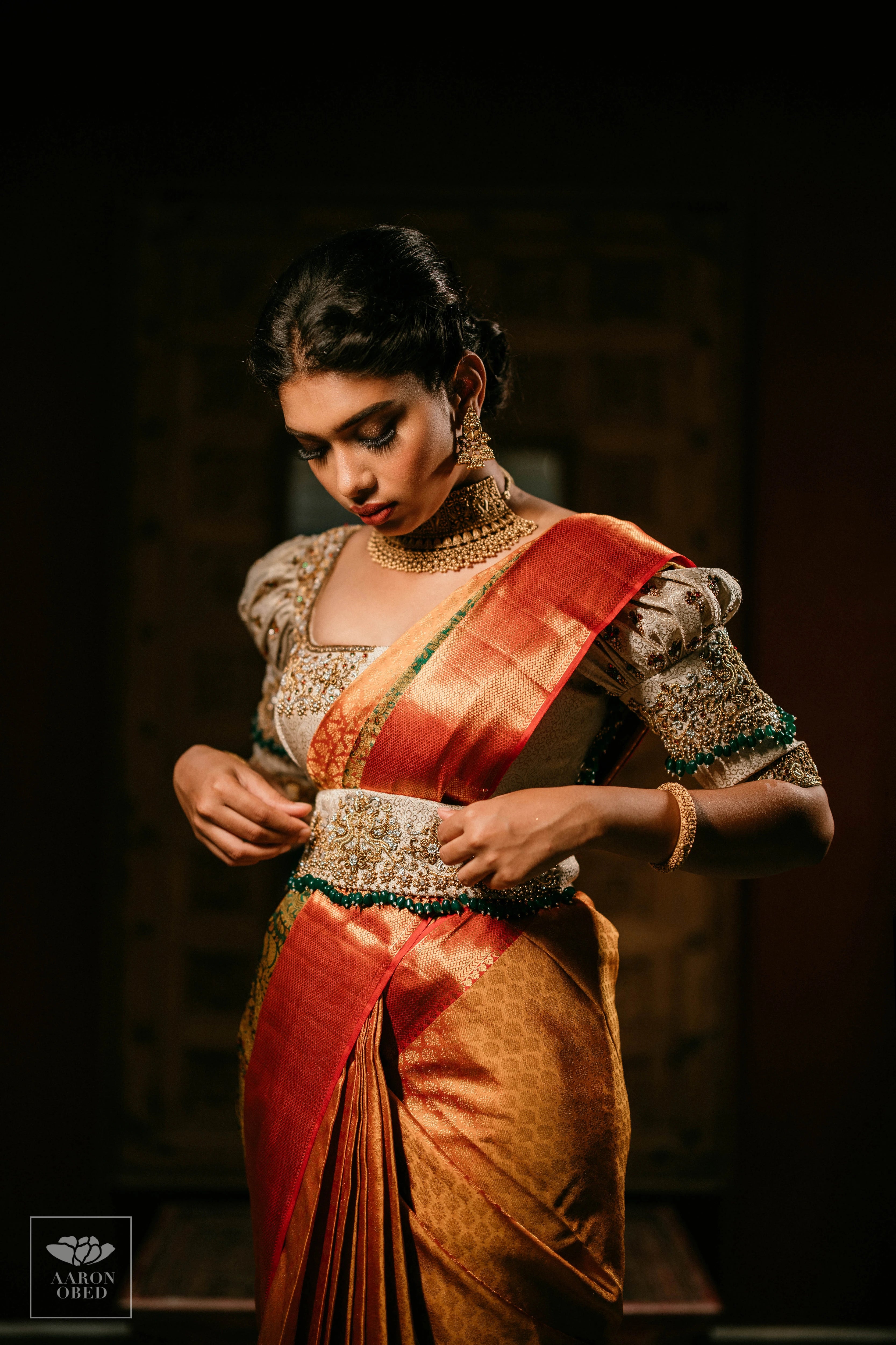 Actress Dushara Vijayan posing in a concept ivory brocade blouse and belt, intricately handcrafted with zardozi, beads, crystals, zari and kundan.