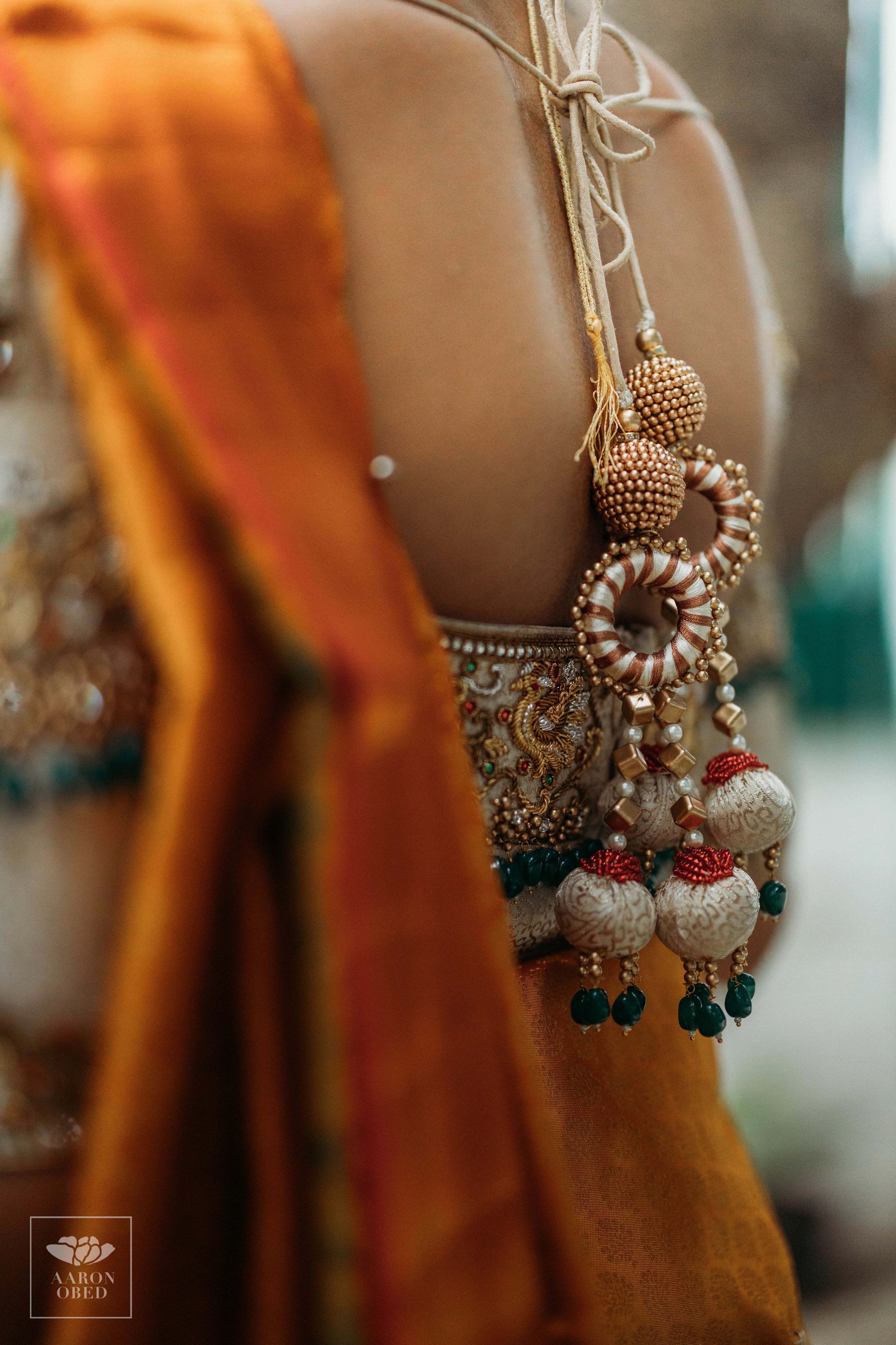Actress Dushara Vijayan showcasing blouse back design in a concept ivory brocade blouse and belt, intricately handcrafted with zardozi, beads, crystals, zari and kundan.