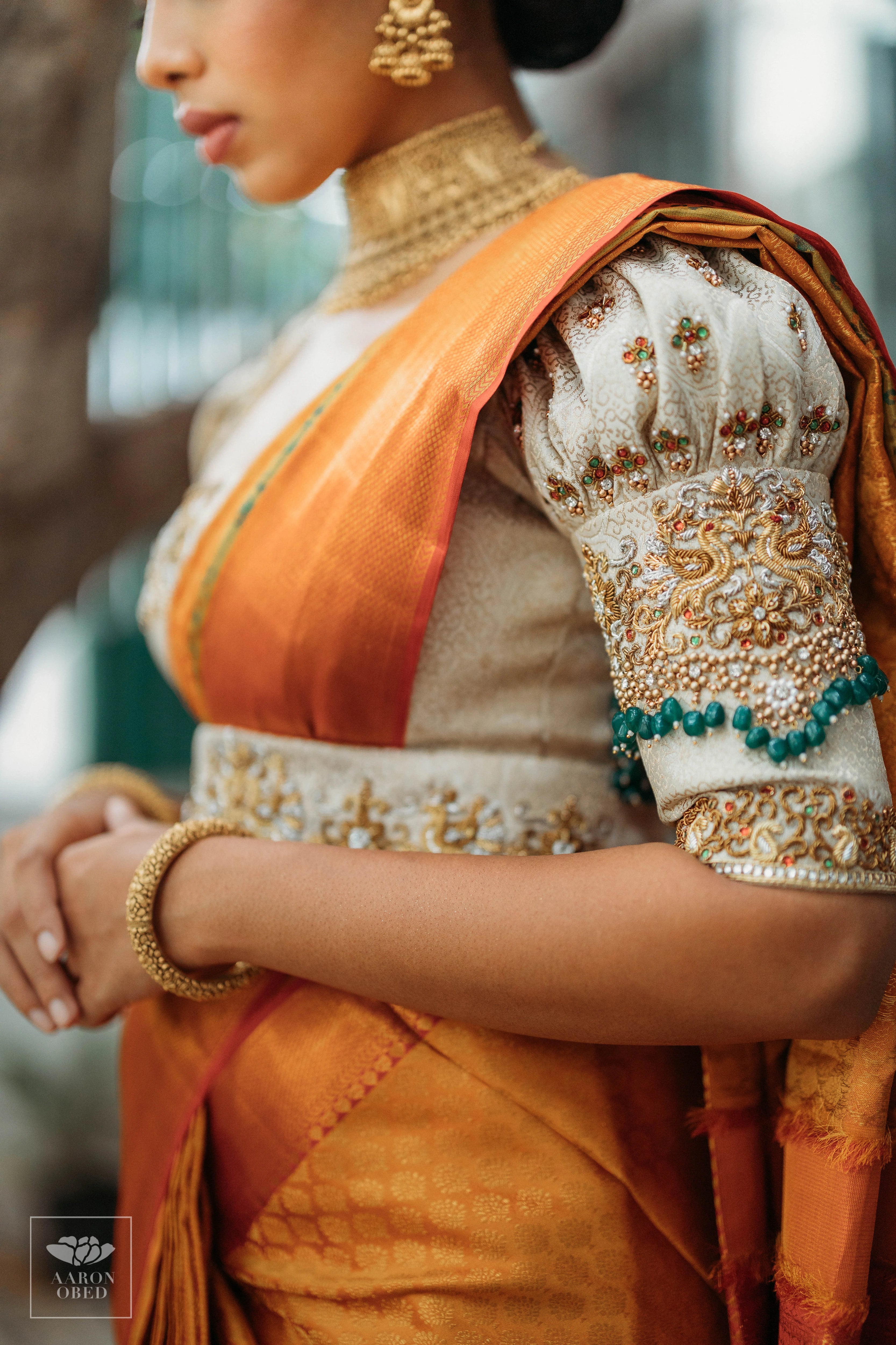 Actress Dushara Vijayan showcasing sleeve in a concept ivory brocade blouse and belt, intricately handcrafted with zardozi, beads, crystals, zari and kundan.
