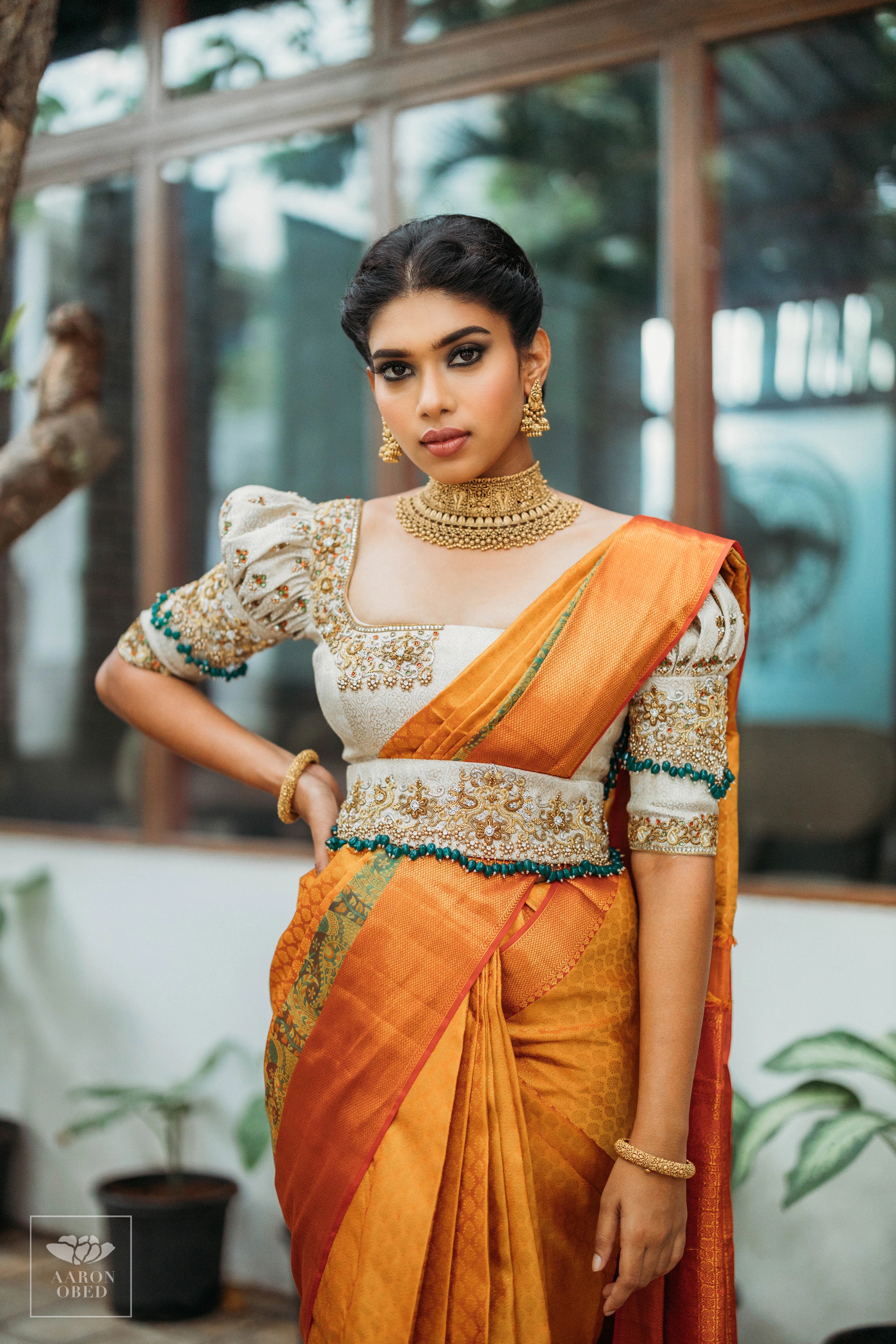 Actress Dushara Vijayan smiling in a concept ivory brocade blouse and belt, intricately handcrafted with zardozi, beads, crystals, zari and kundan.