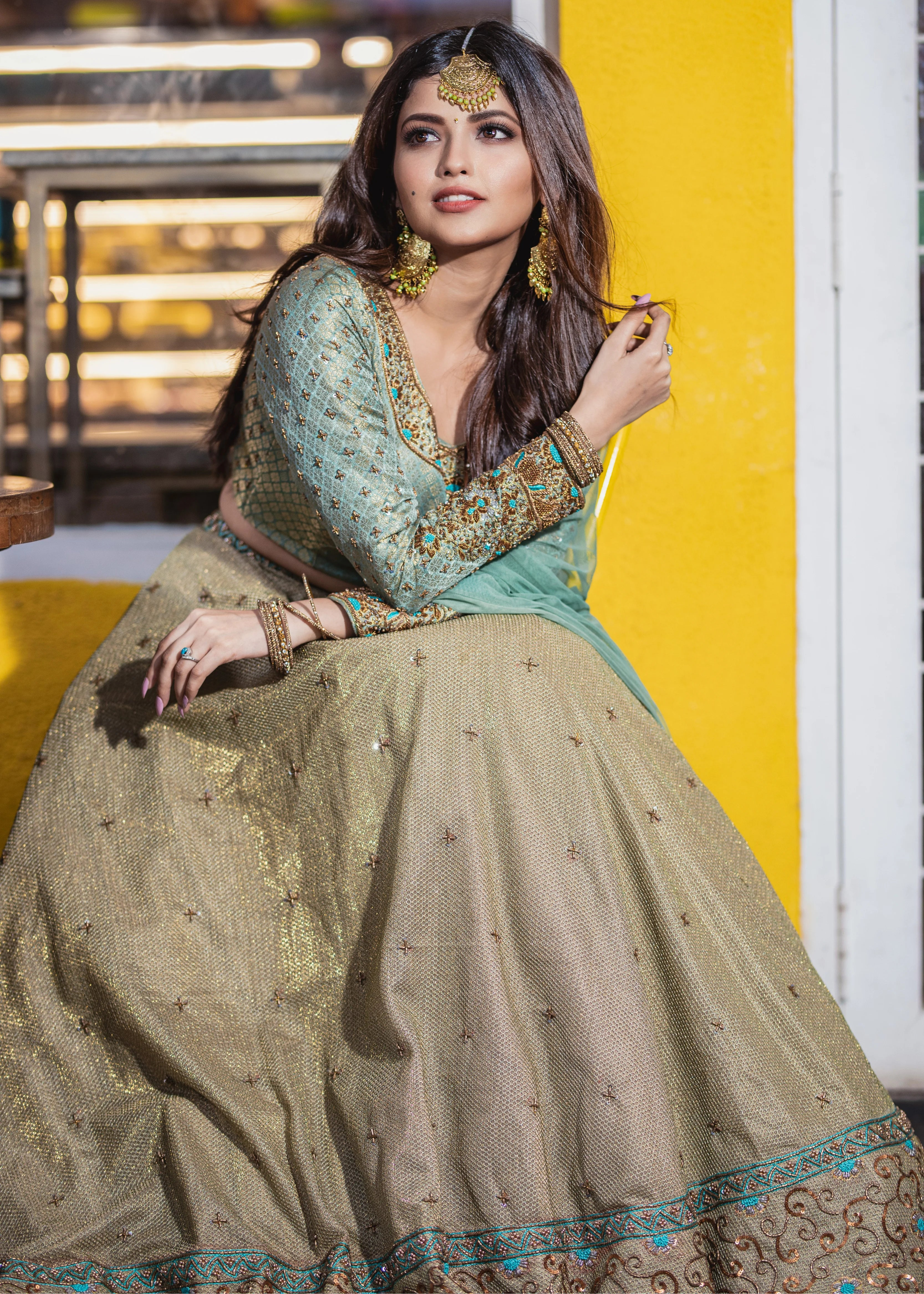 Actress Shirin Kanchwala in a handcrafted banaras (brocade) lehenga in shades of light sea green / pista blue / cyan designed by Archana Karthick.