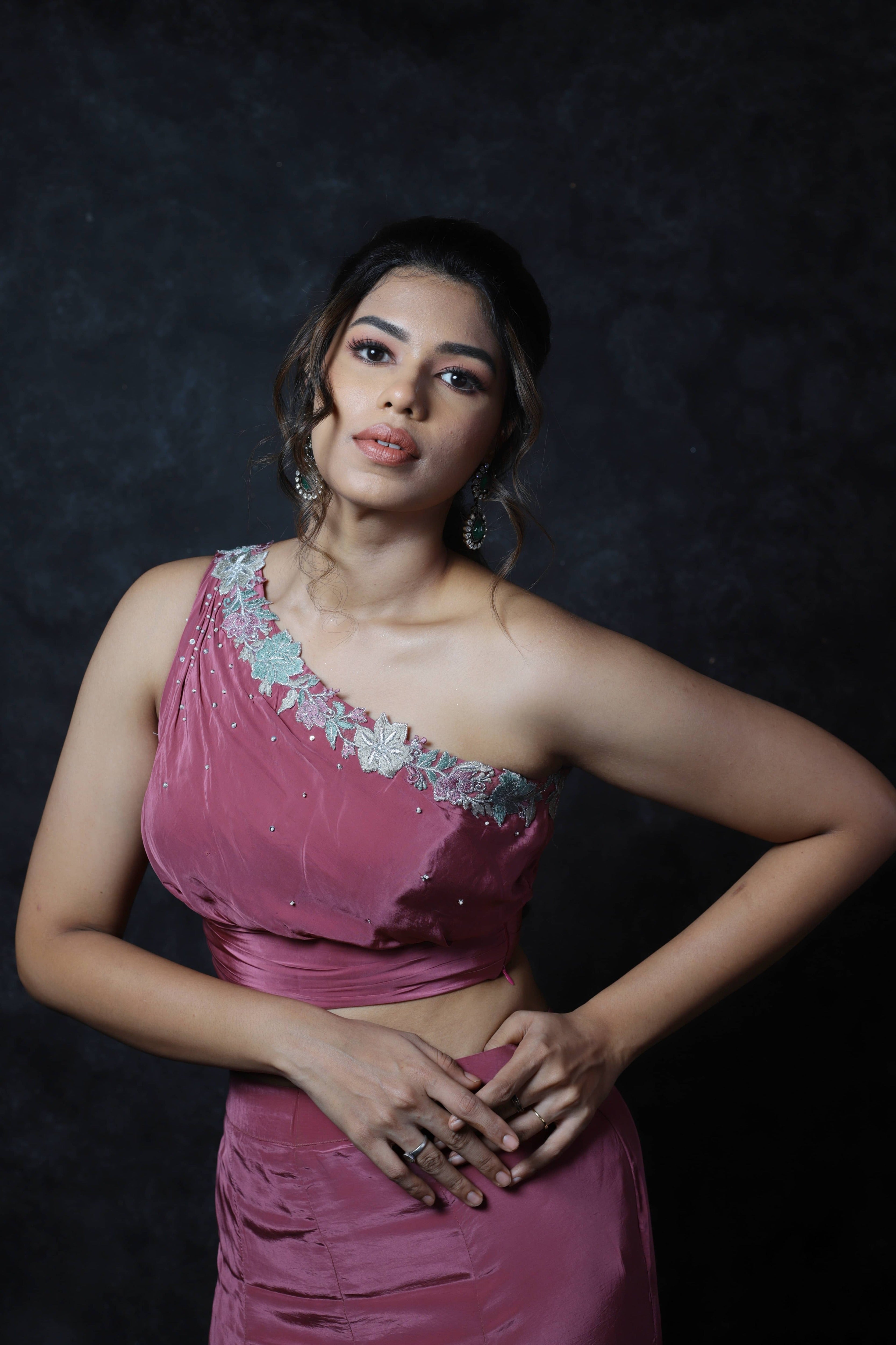 Actress Shrisha the niece of superstar actress Sridevi in a one shoulder mermaid fit dress with a trail. Closeup for full front top detailing captured.