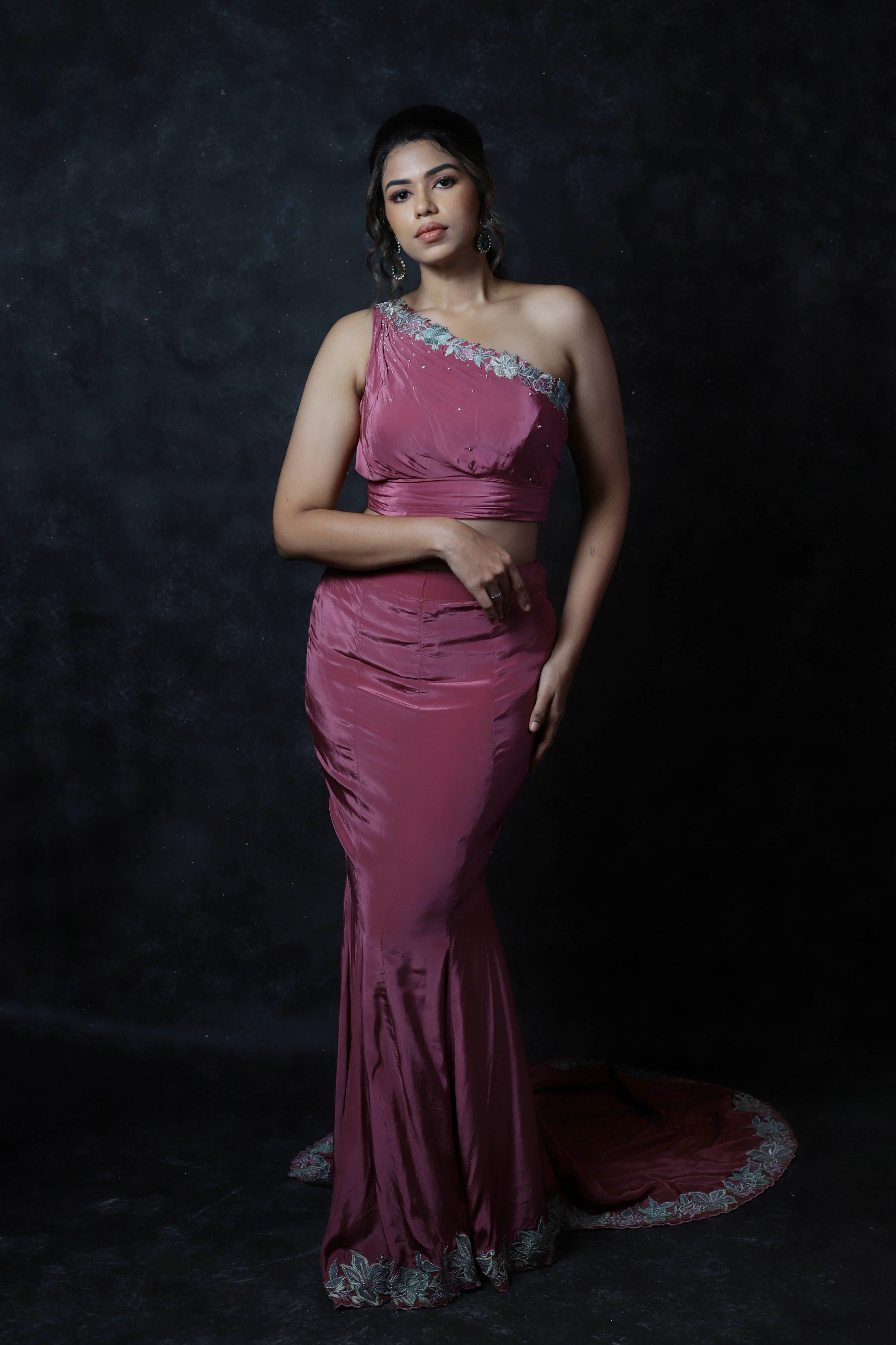 Actress Shrisha the niece of superstar actress Sridevi in a one shoulder mermaid fit dress with a trail. Full front detailing captured.