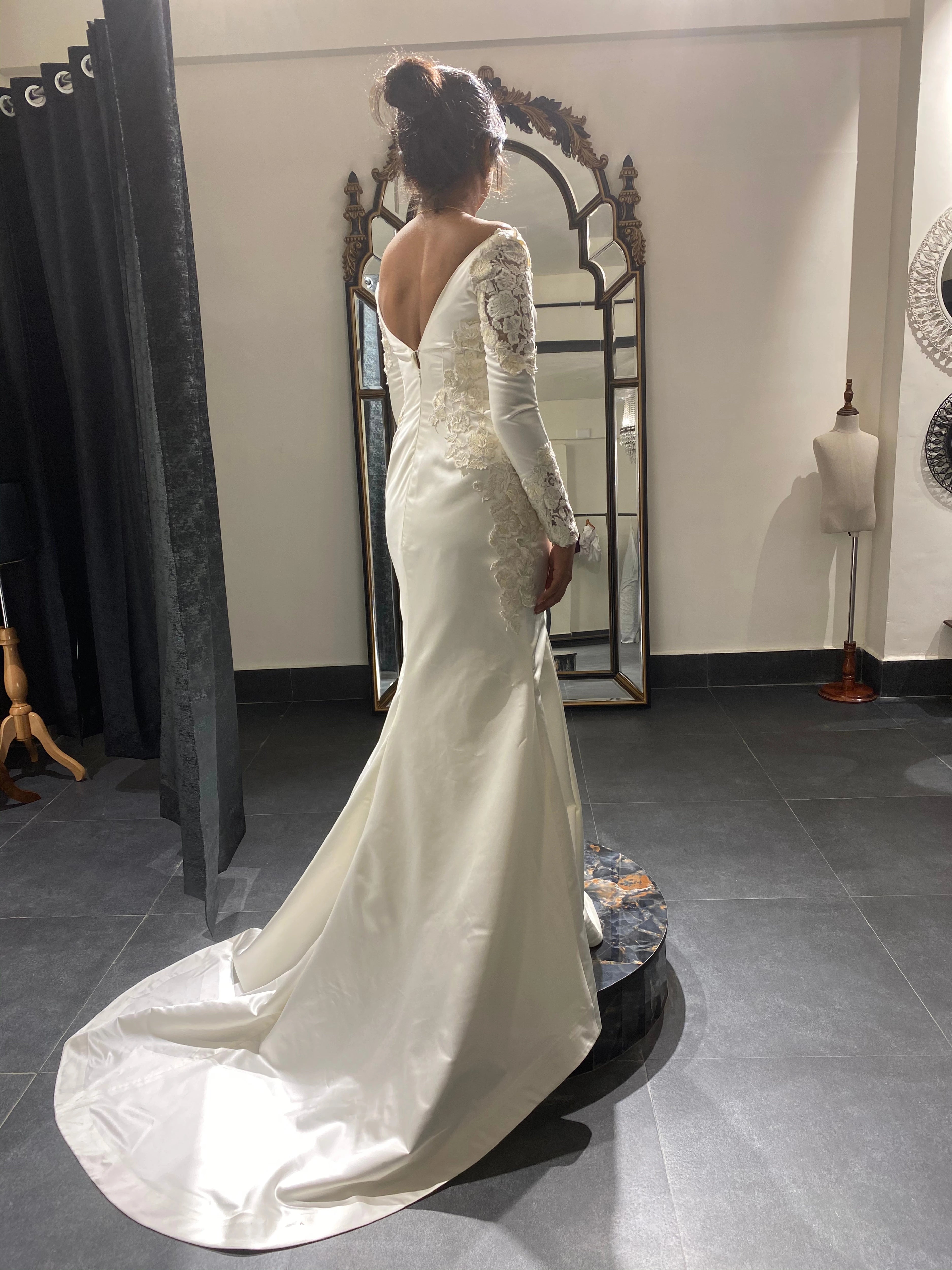 Adeal Josh during fittings in a white gown for her church wedding, handcrafted by team Archana Karthick.