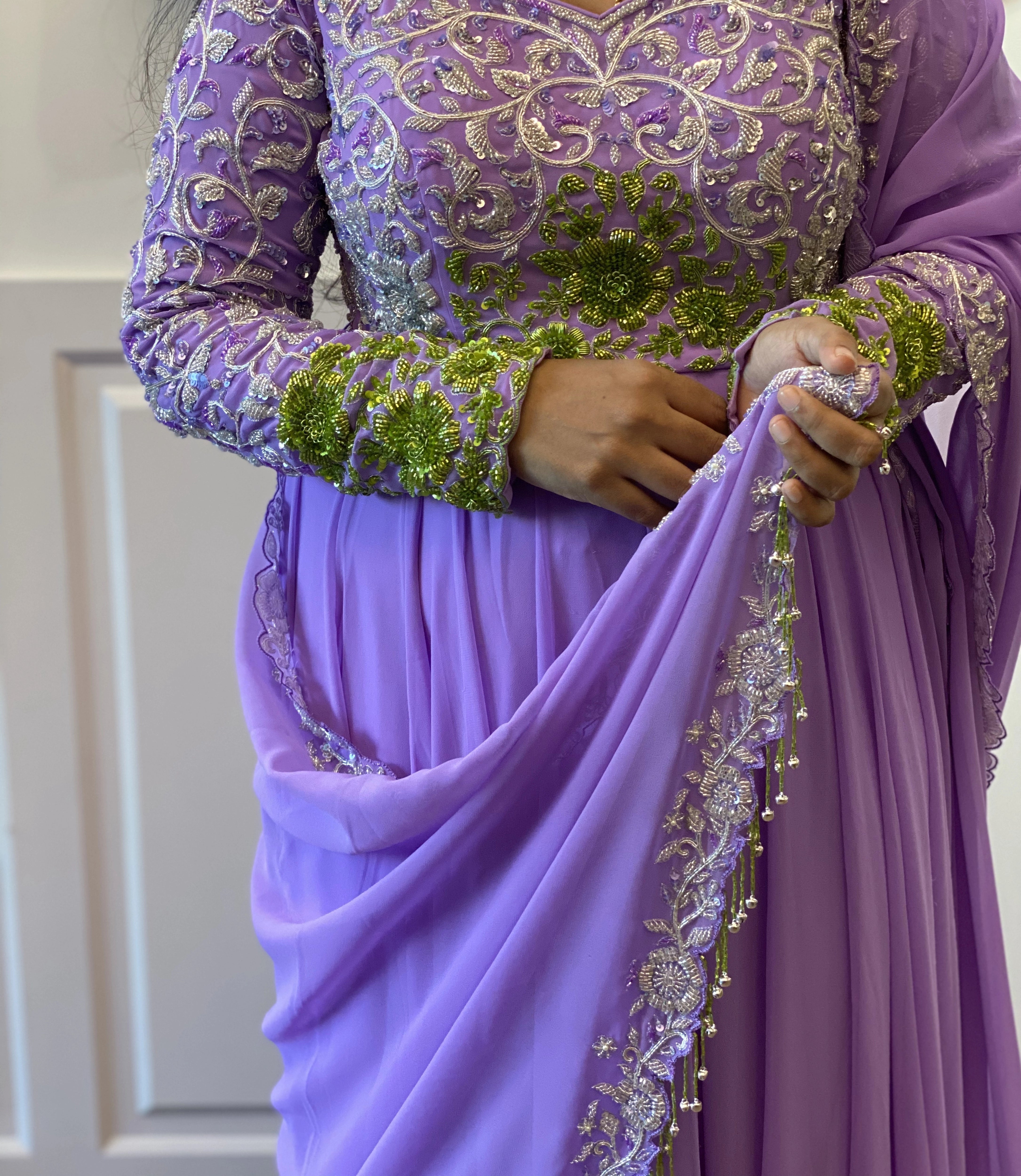 Archana Ajay Kumar posing in a lavender anarkali, intricately handcrafted with cutdana, sequins and zardozi by team Archana Karthick.