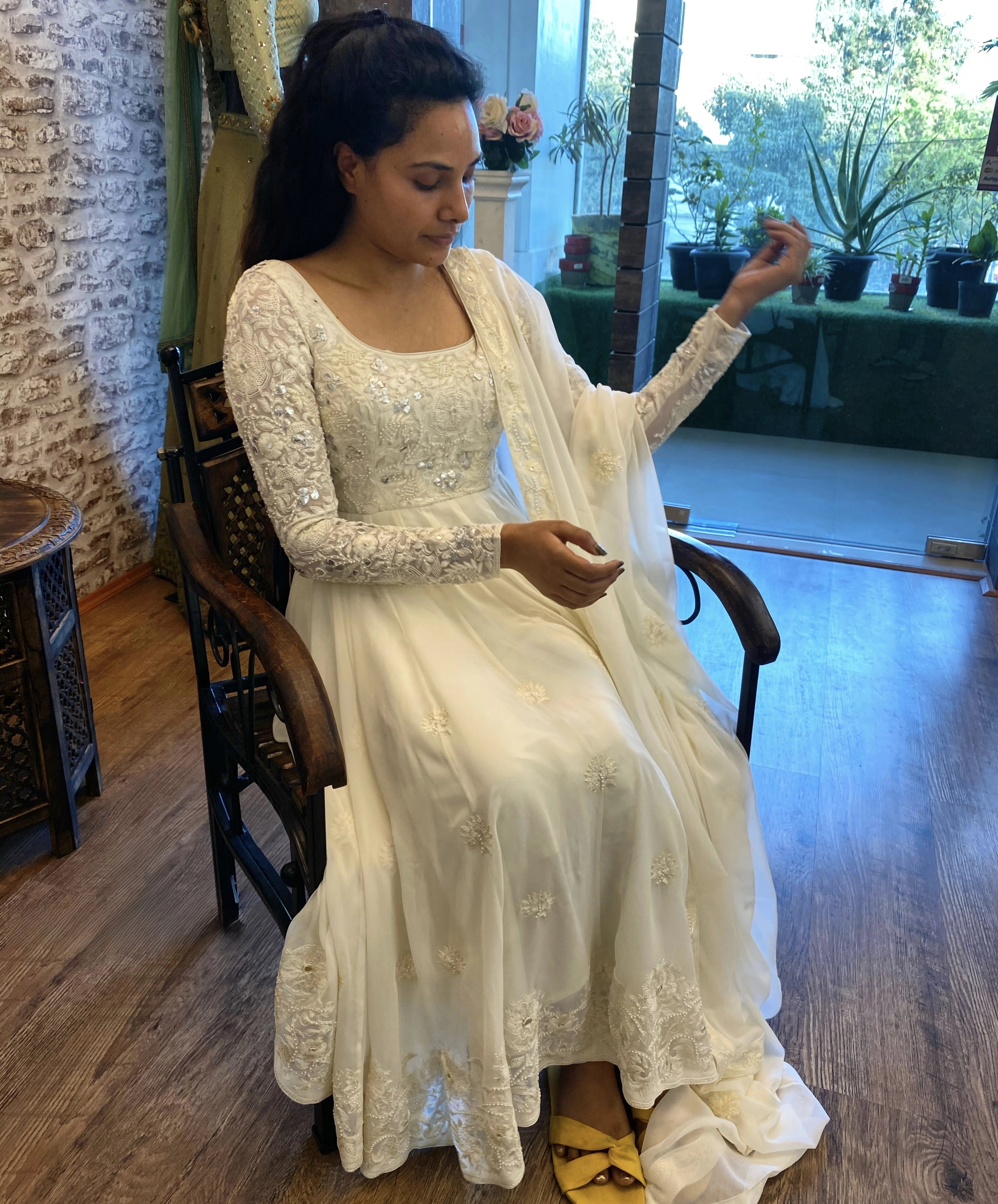 Arshitha from Bangalore during her fittings in a white georgette anarkali, intricately handcrafted with gotapati, resham (chikanakri work) by team Archana Karthick.