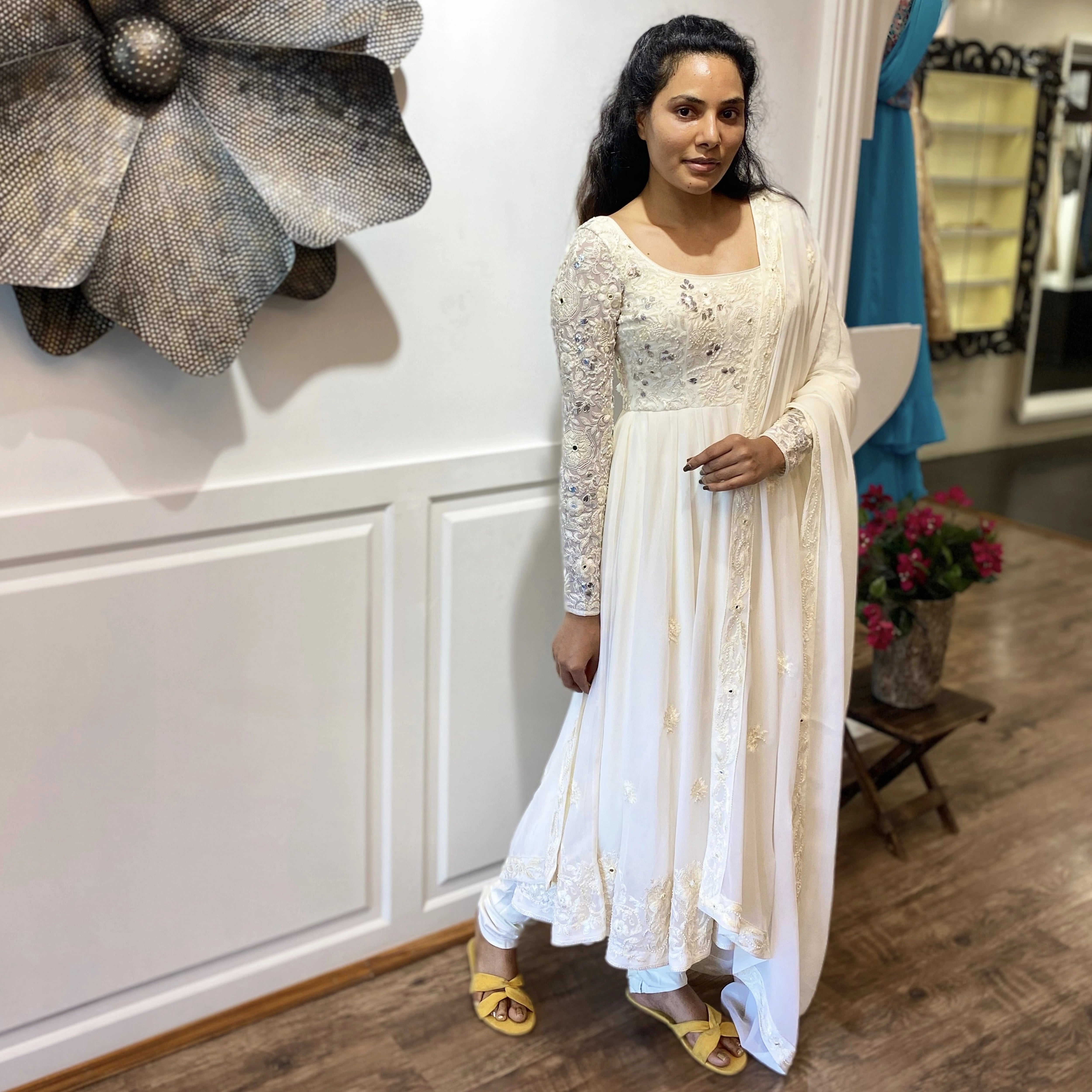 Arshitha from Bangalore in a white georgette anarkali, intricately handcrafted with gotapati, resham (chikanakri work) by team Archana Karthick.