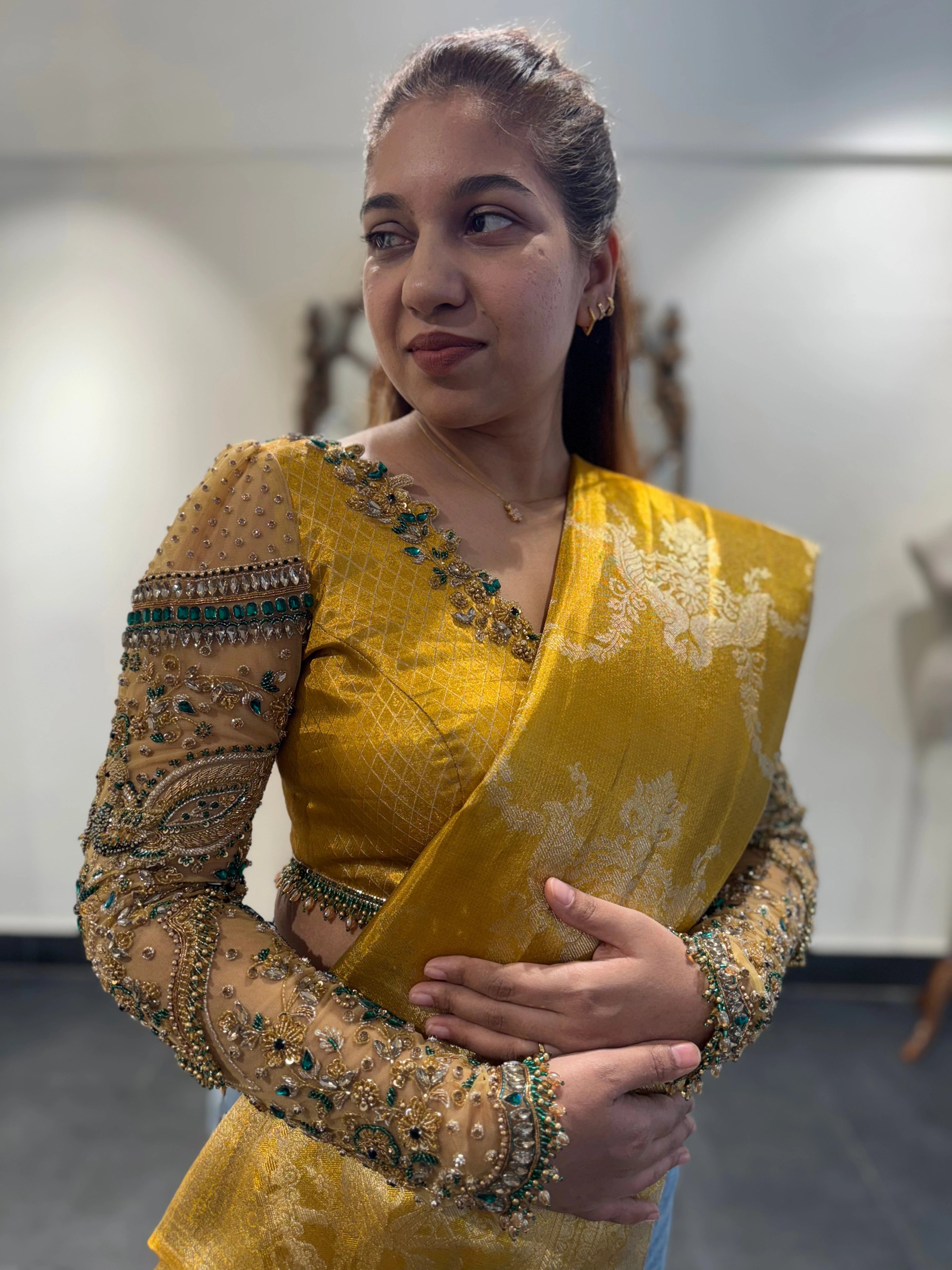 Bhavana during fittings for her son's 1st birthday in a yellow silk blouse by team Archana Karthick.