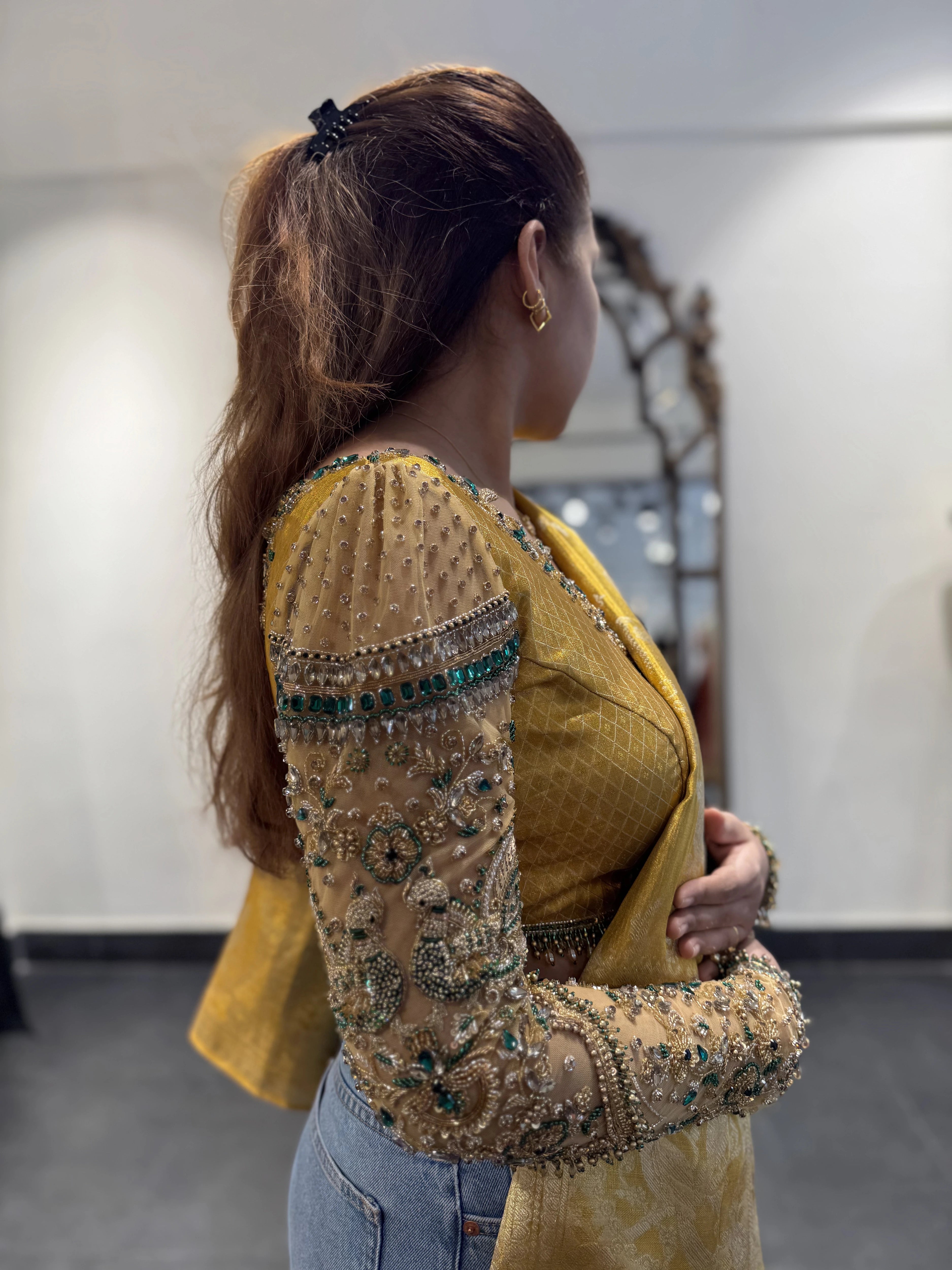 Bhavana during fittings for son's 1st birthday in a yellow silk blouse by team Archana Karthick.