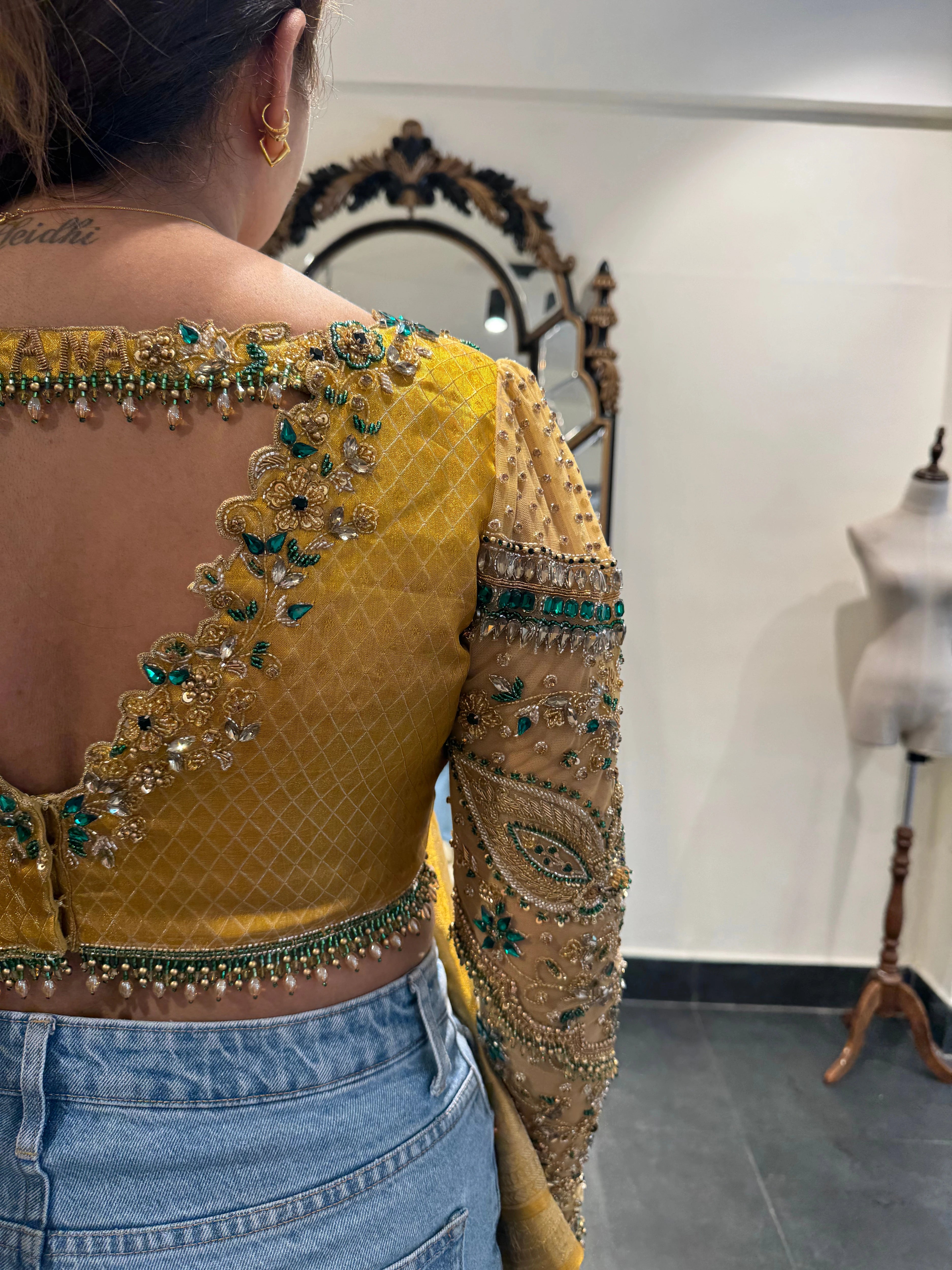 Bhavana during fittings in a yellow silk blouse by team Archana Karthick.