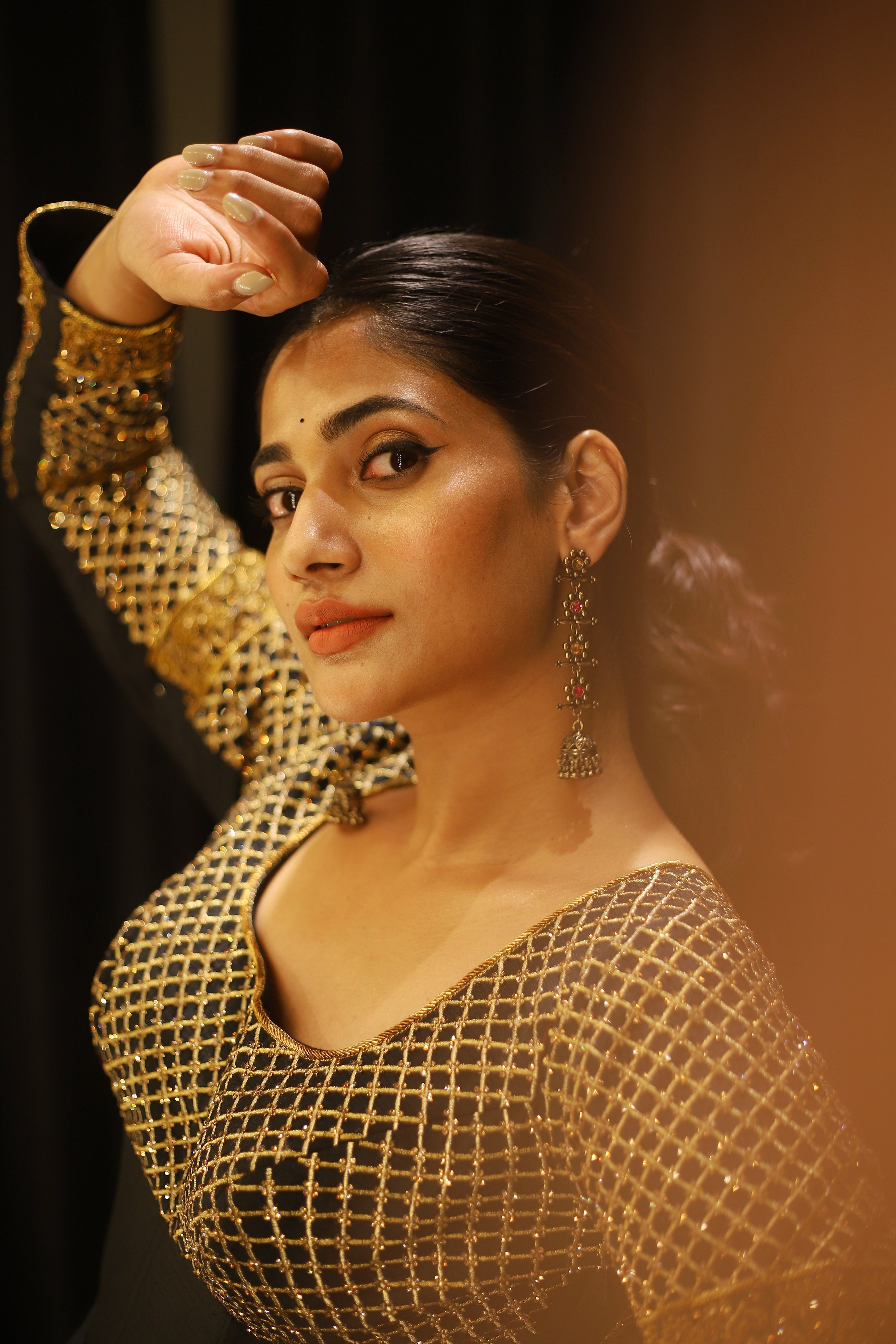 Bigg Boss fame and Actress Losliya Mariyanesan in Black Designer Anarkali by Archana Karthick looking left at camera with hand on forehead
