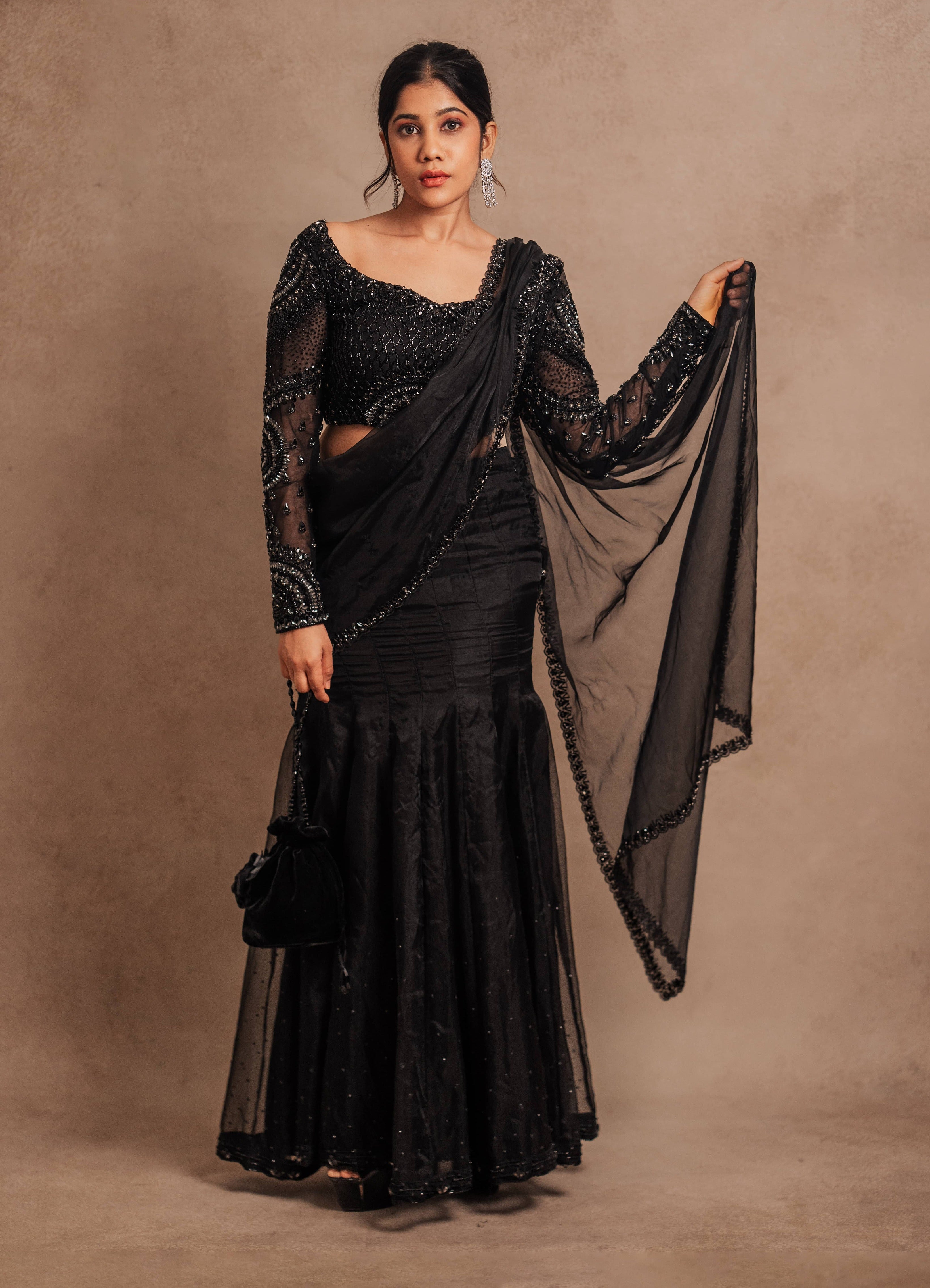 Black organza mermaid saree intricately handcrafted with stones, crystals, and sequins designed by team Archana Karthick.