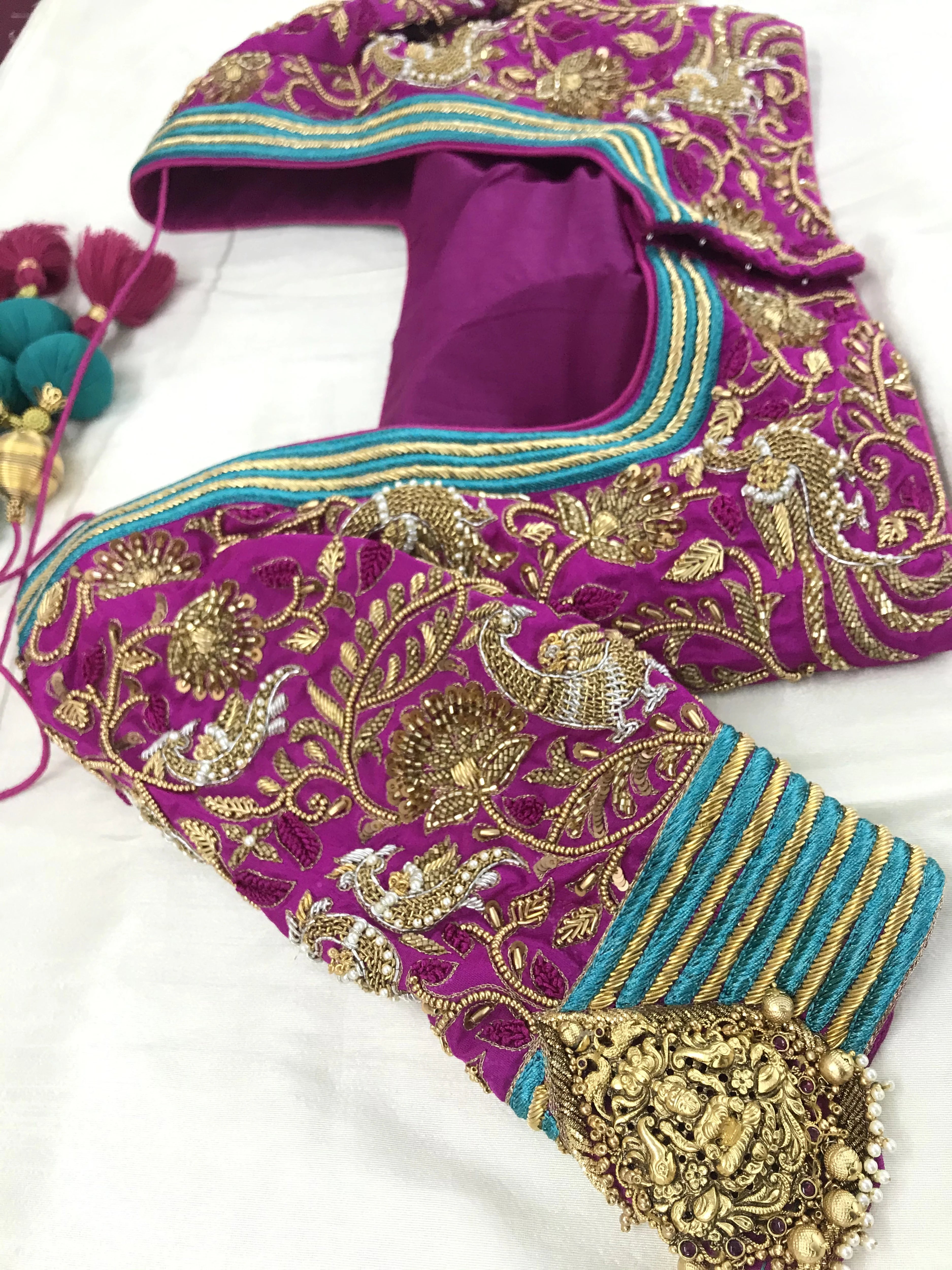 Bridal Blouse in pink silk with zardozi, kundan, resham knot work and kundan embellishments. Designed by Archana Karthick.