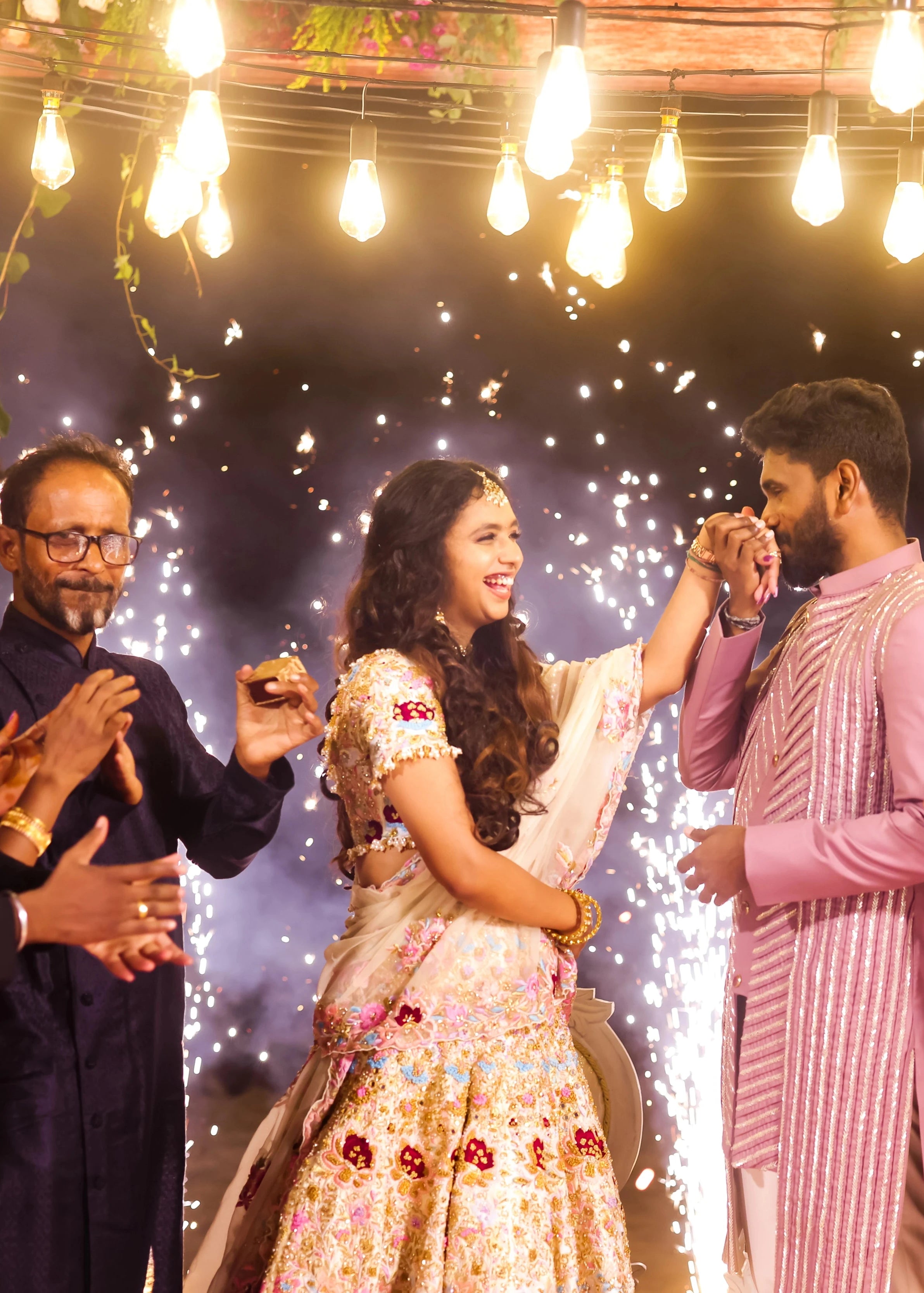 Bride Aarthi Rajagopal from USA laughinig in a concept ivory lehenga, intricately handcrafted with resham knot work, crystals, cutdana, pearls, sequins and zardozi.