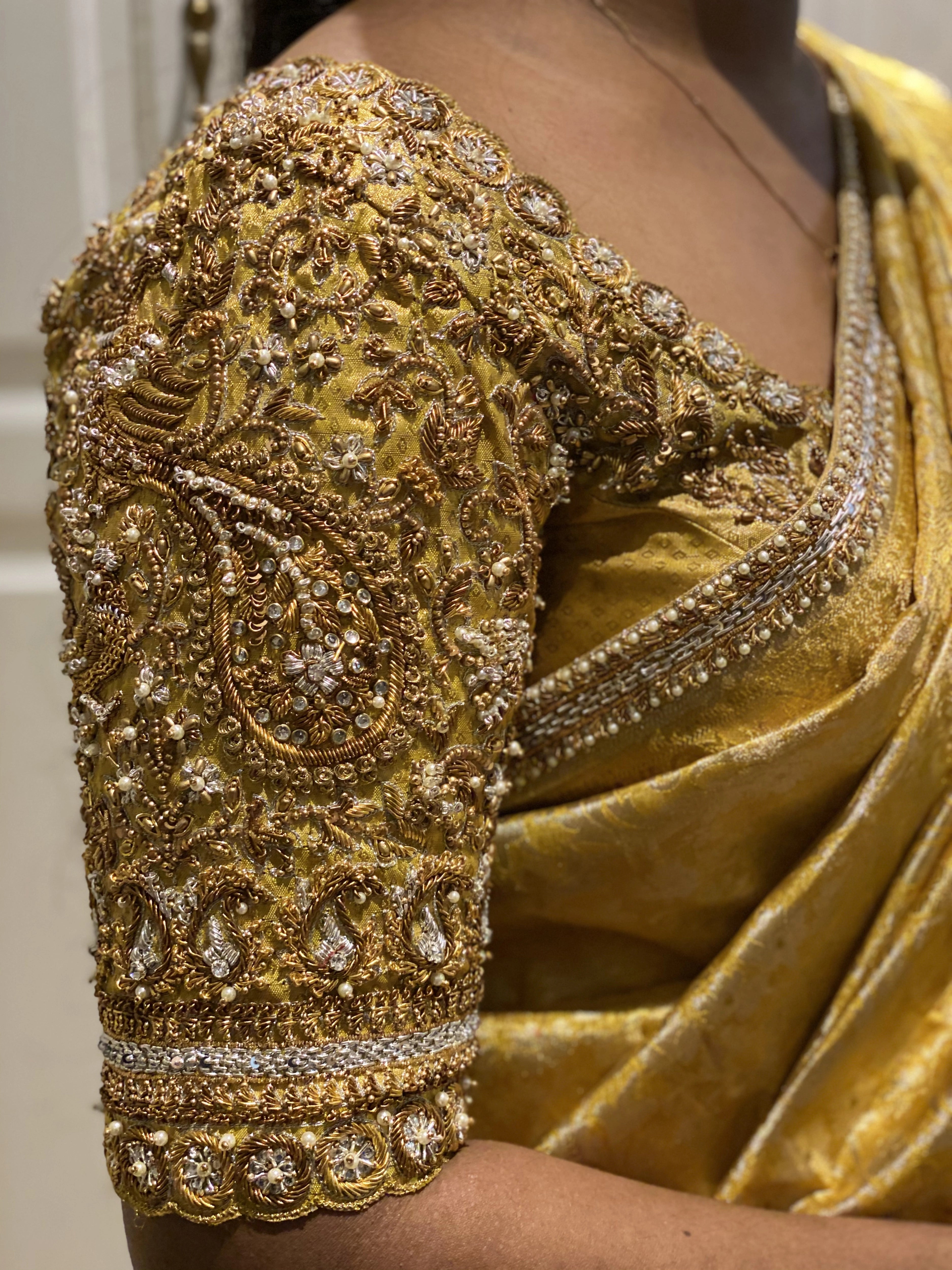 Bride Abinaya V during fittings in a gold concept silk blouse and saree border, intricately handcrafted with zardosi, beads, stone, zari and pearls by team Archana Karthick.