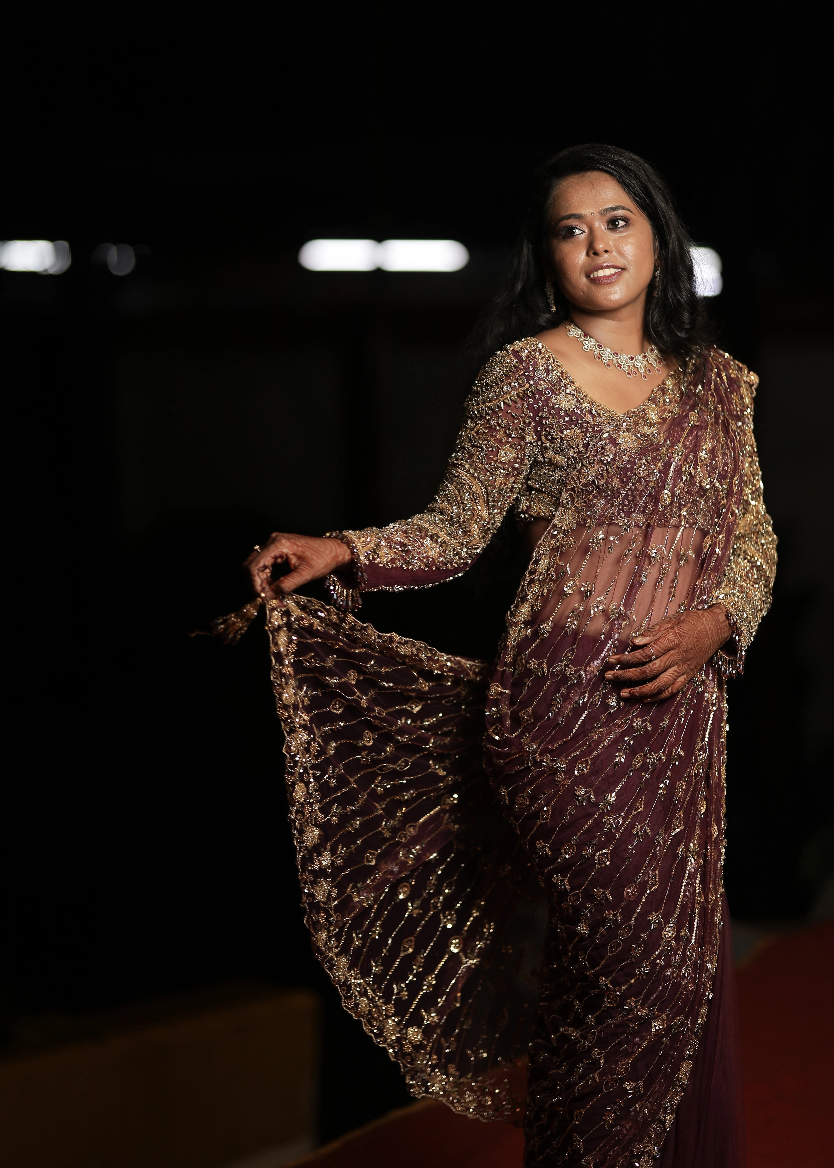 Bride Akalya in a wine red tulle saree handcrafted by team Archana Karthick.