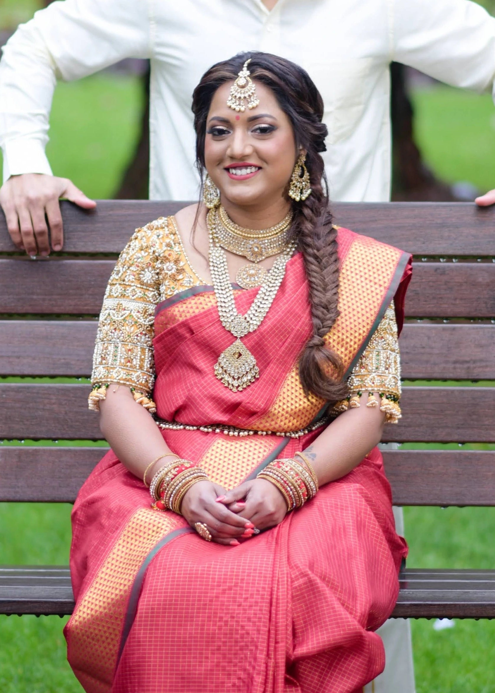 Bride Angeline from Canada in a gold silk blouse handcrafted by team Archana Karthick.