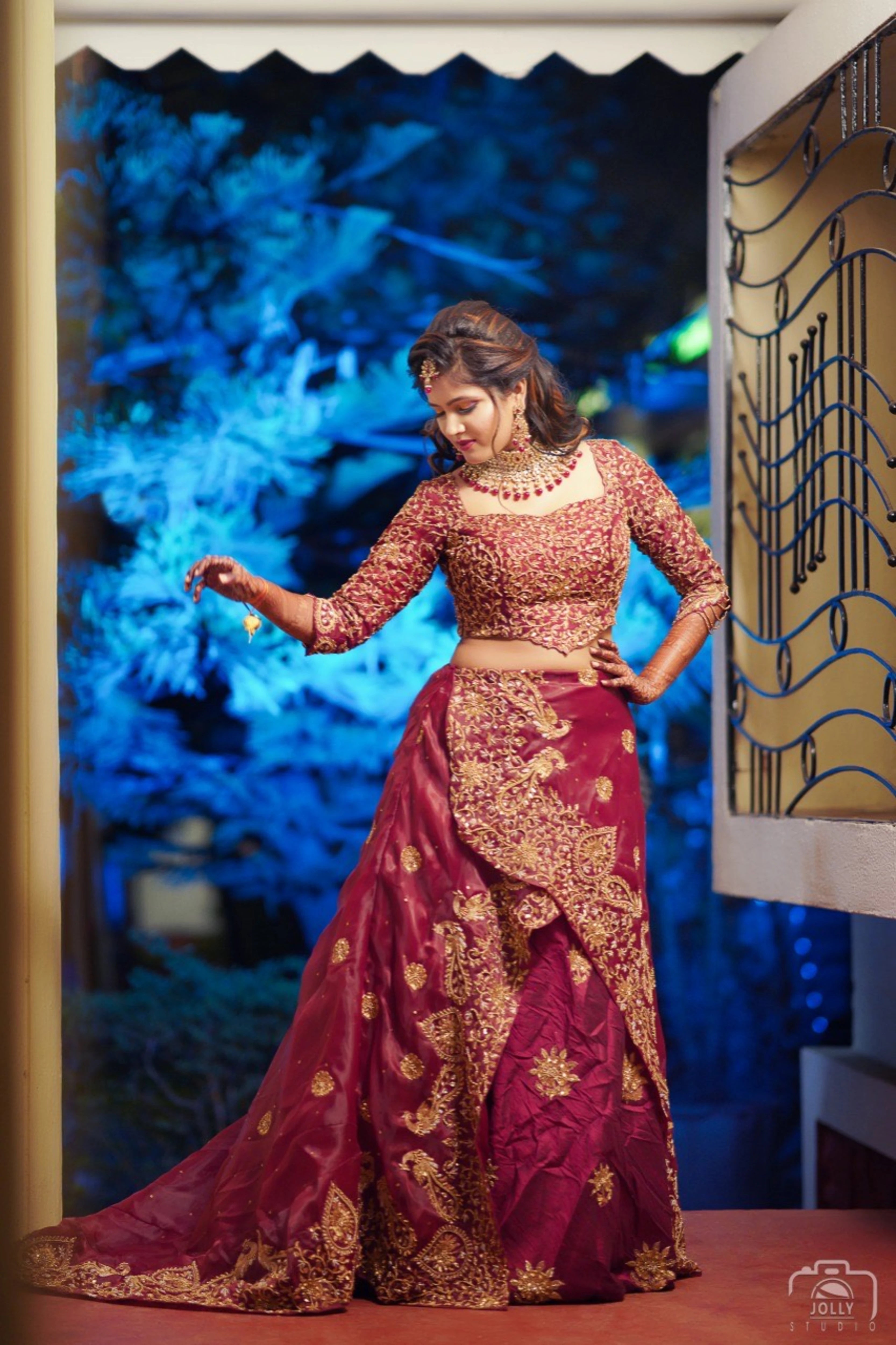 Bride Ankita Singh in a red lehenga intricatelty handcrafted with resham, cutdana, zari and beads by team Archana Karthick.