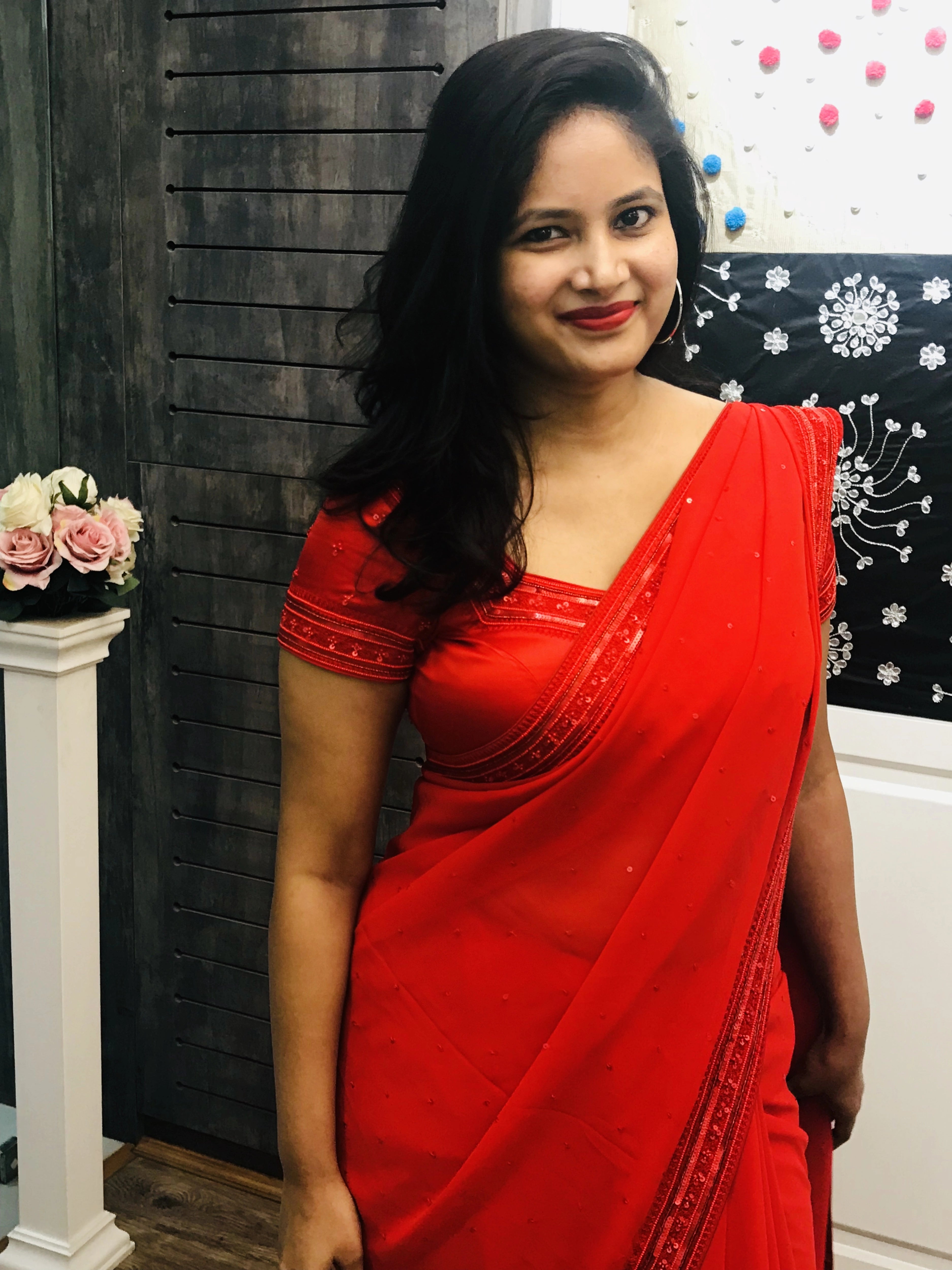Bride Ankita during fittings in a red georgette saree and blouse handcrafted by team Archana Karthick.