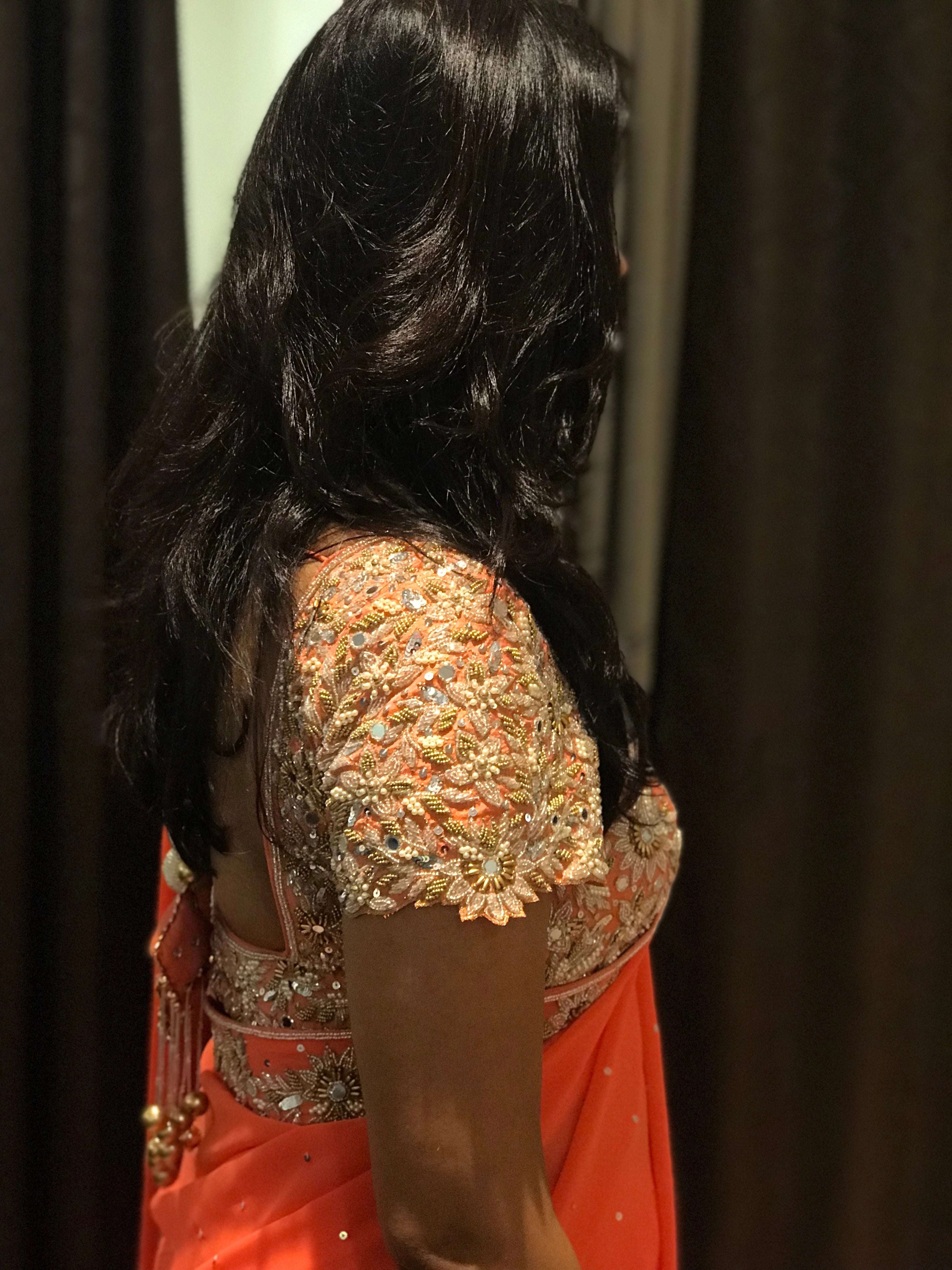 Bride Ankita during her fittings in an orange georgette saree and blouse handcrafted by team Archana Karthick.