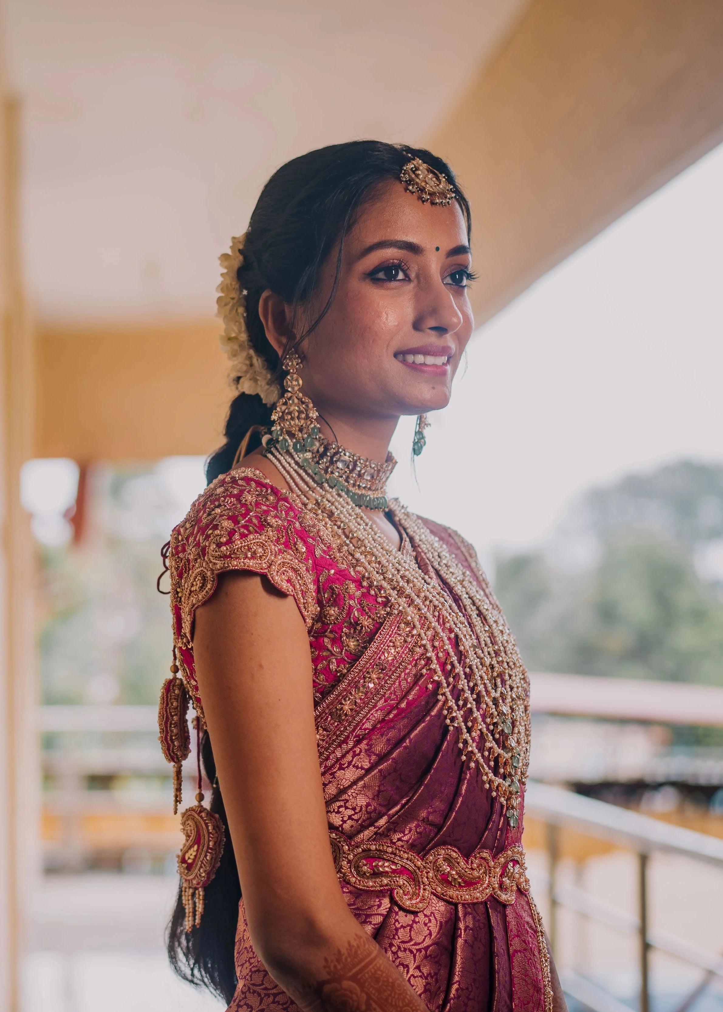 Bride Anusha K in a pink concept raw silk blouse, belt and saree border, handcrafted with zardosi, beads, kundan, cutdana, pearls and sequins by team Archana Karthick