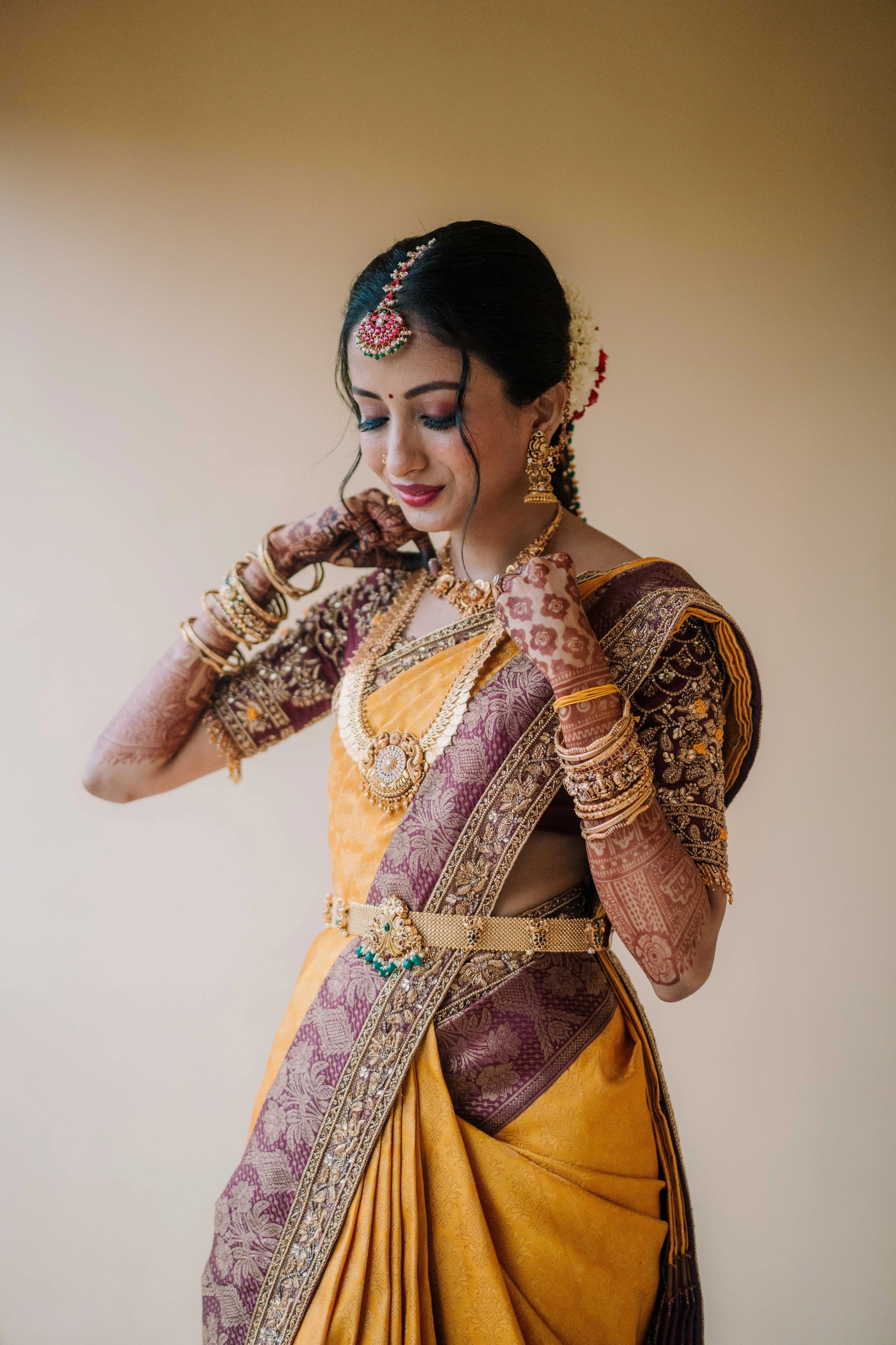 Bride Anusha K in a wine red concept raw silk blouse, veil and saree border, handcrafted with zardosi, beads, resham, crystals, sequins etc by Archana Karthick.