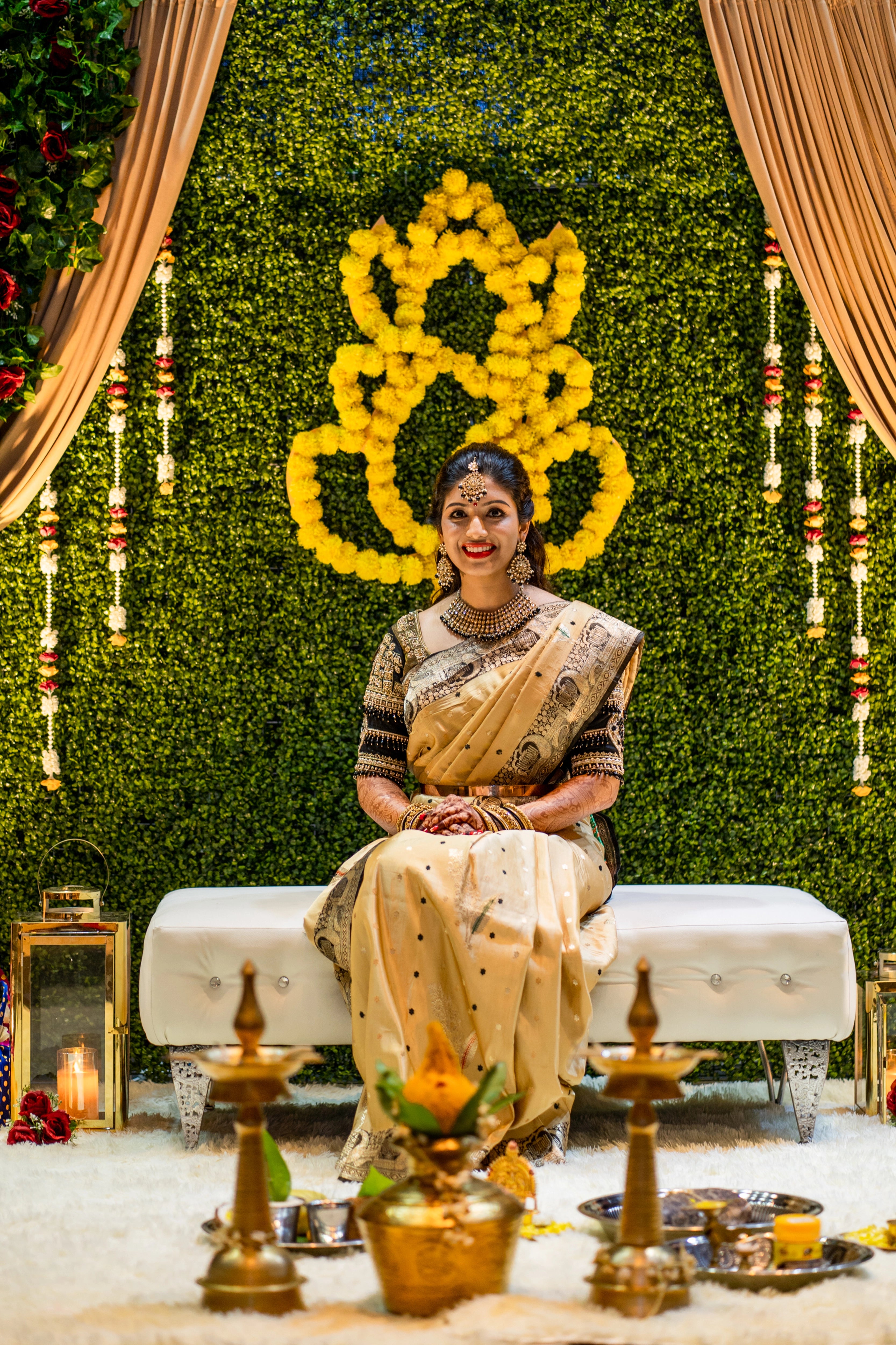 Bride Anusha from Malaysia smiling in a black raw silk blouse by team Archana