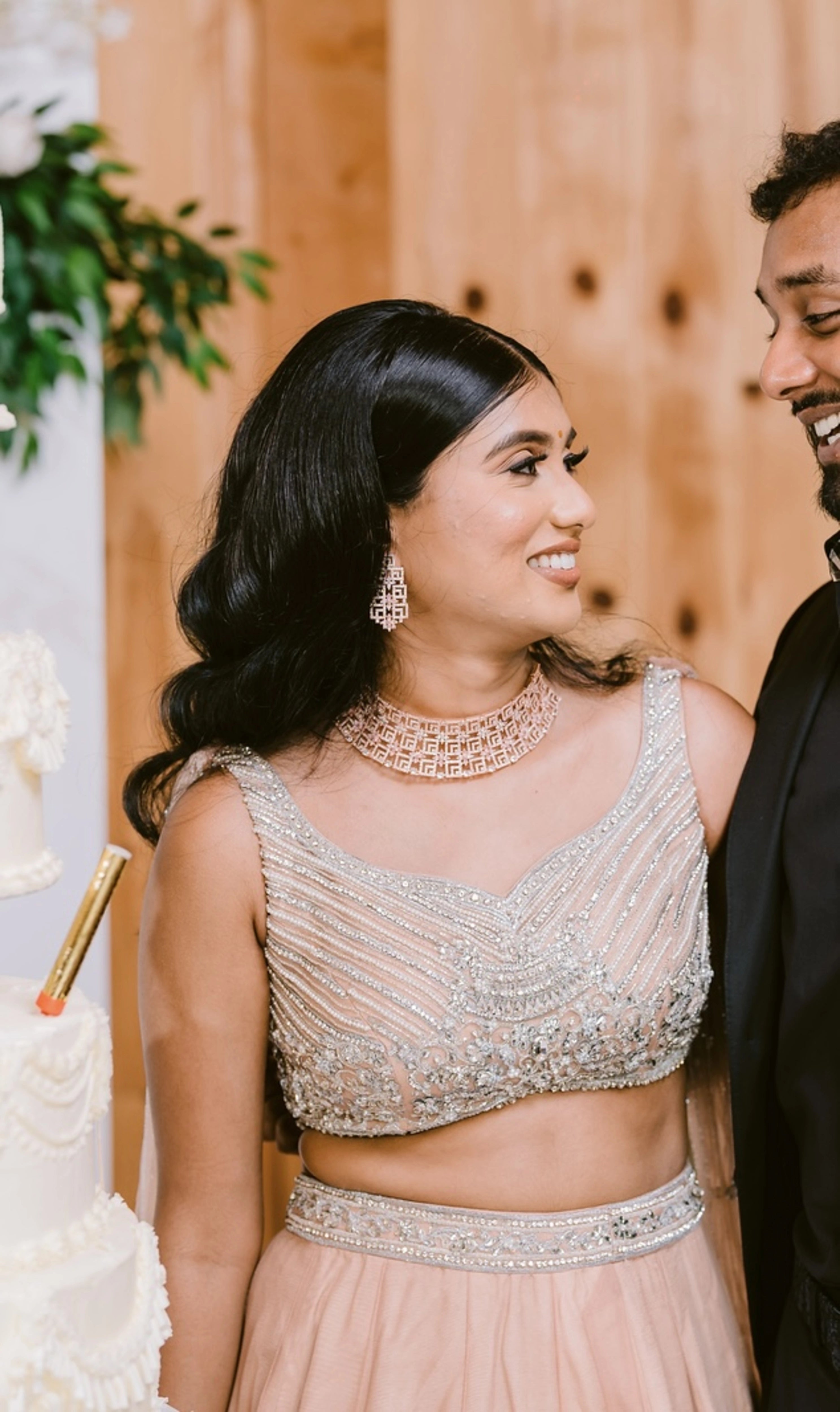 Bride Apy from Canada with groom in a blush (shades of peach cream) lehenga, handcrafted by team Archana Karthick.