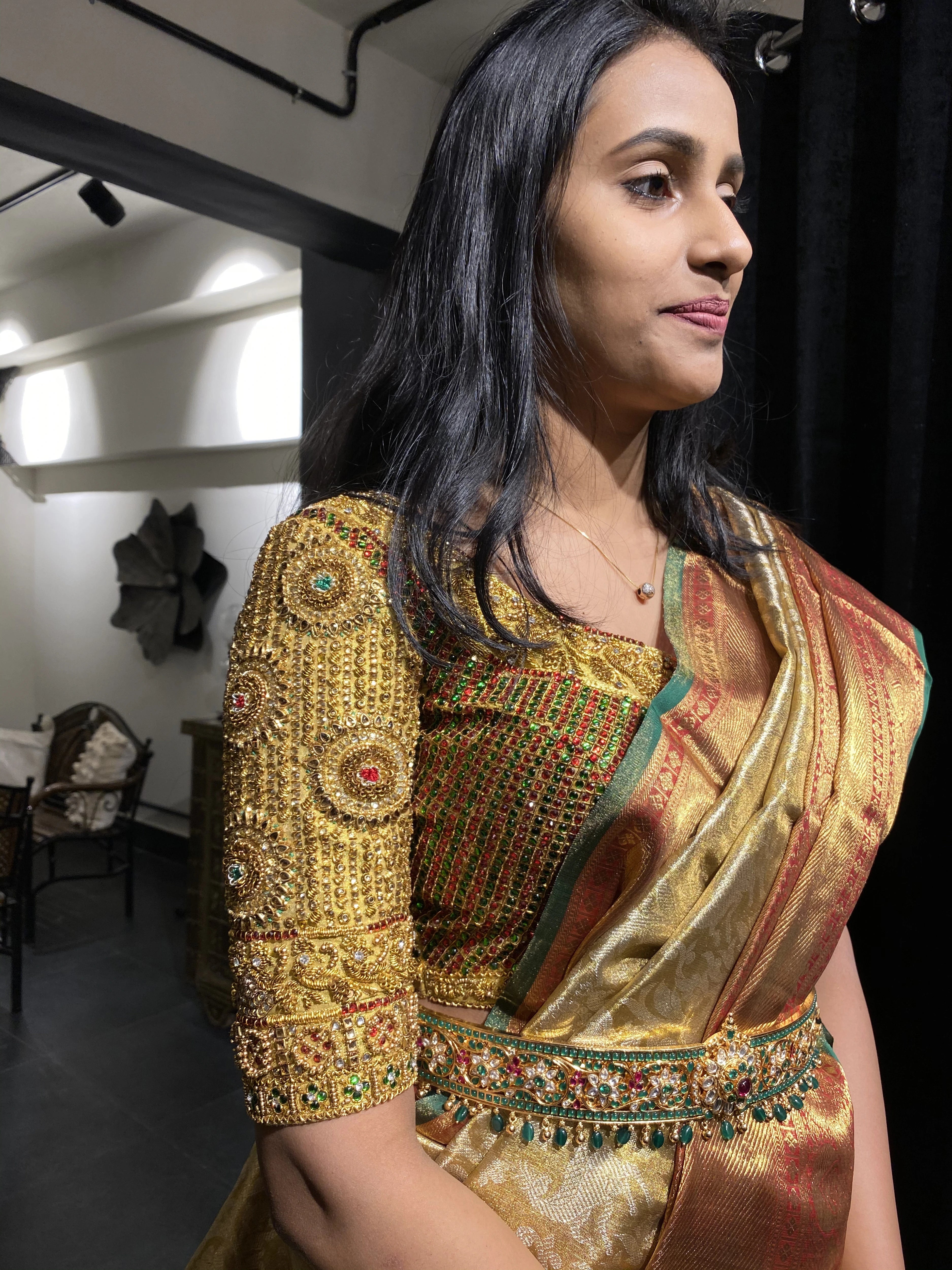 Bride Ashwini during her fittings in a gold silk blouse handcrafted by team Archana Karthick.