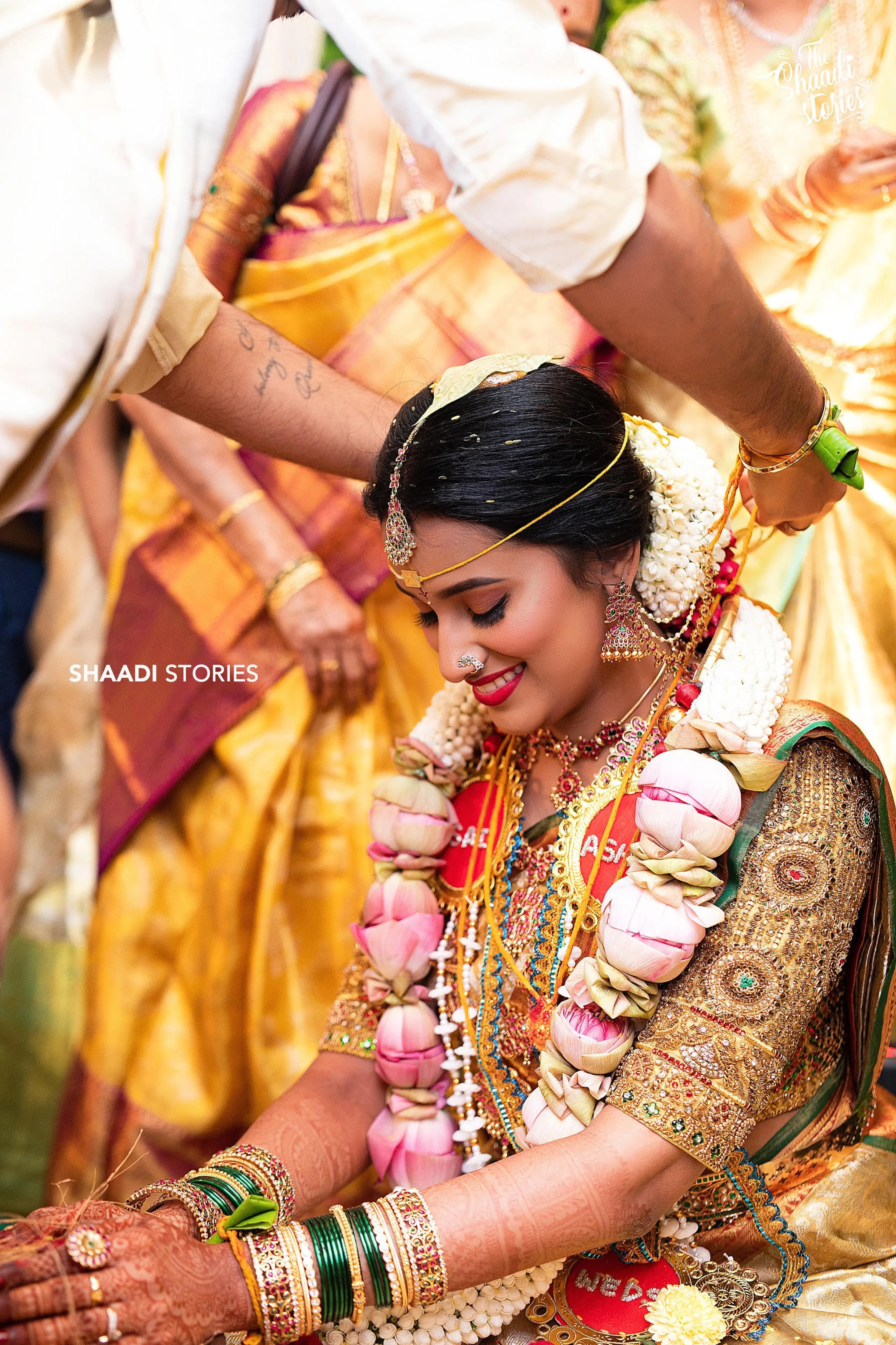Bride Ashwini during rituals in a gold silk blouse handcrafted by team Archana Karthick.