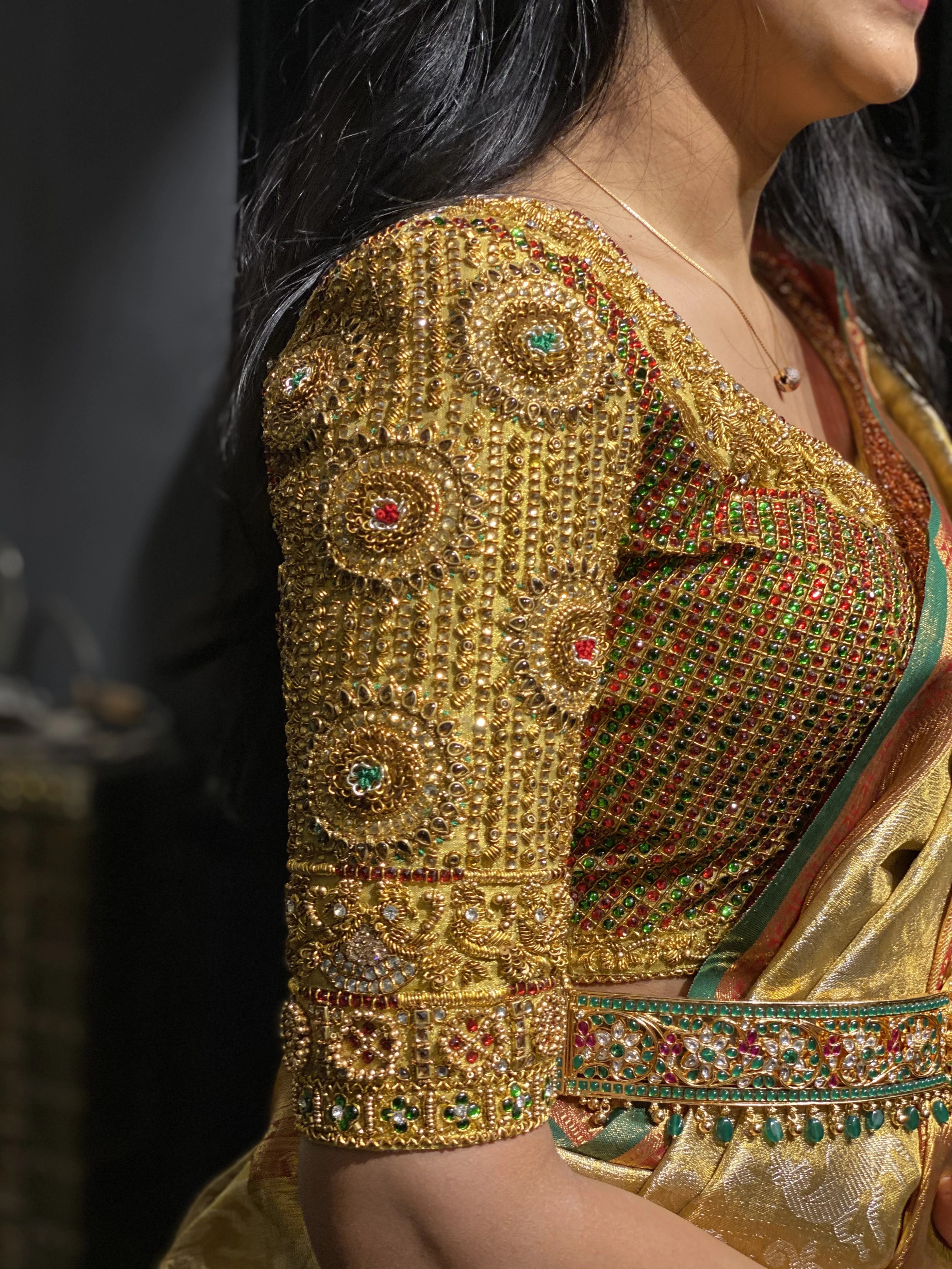 Bride Ashwini during the fittings in a gold silk blouse handcrafted by team Archana Karthick.