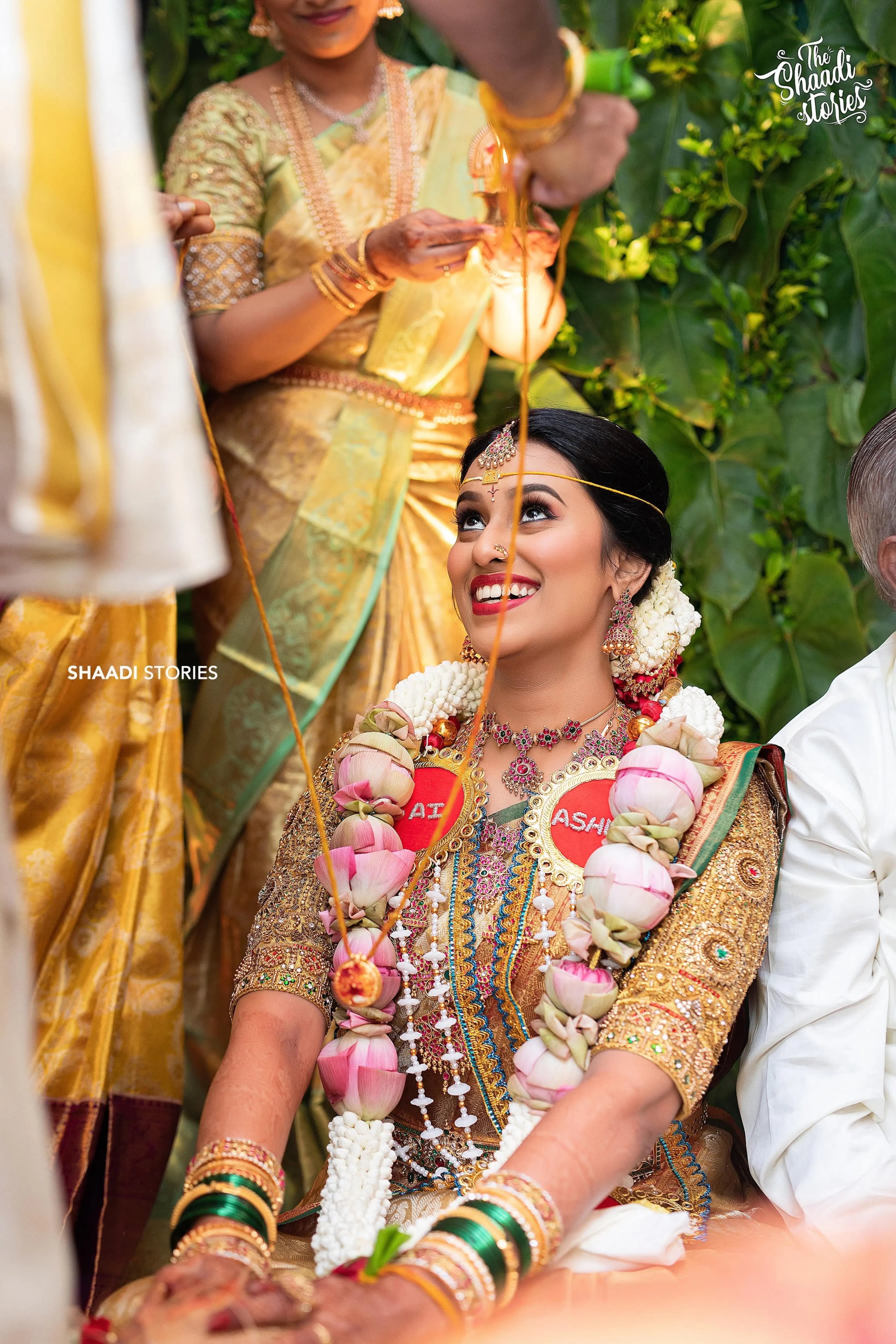 Bride Ashwini during the rituals in a gold silk blouse handcrafted by team Archana Karthick.