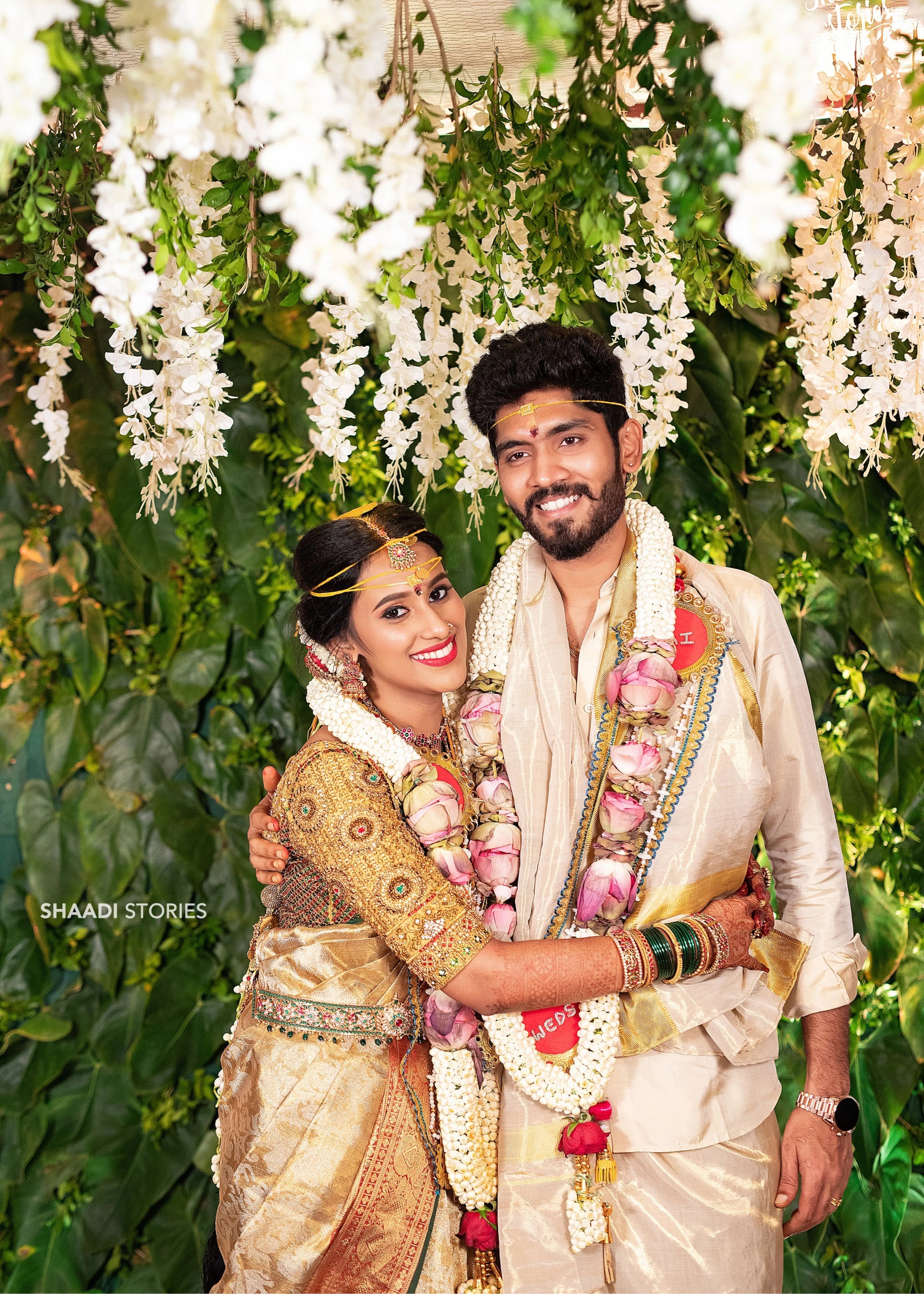 Bride Ashwini in a gold silk blouse handcrafted by team Archana Karthick.