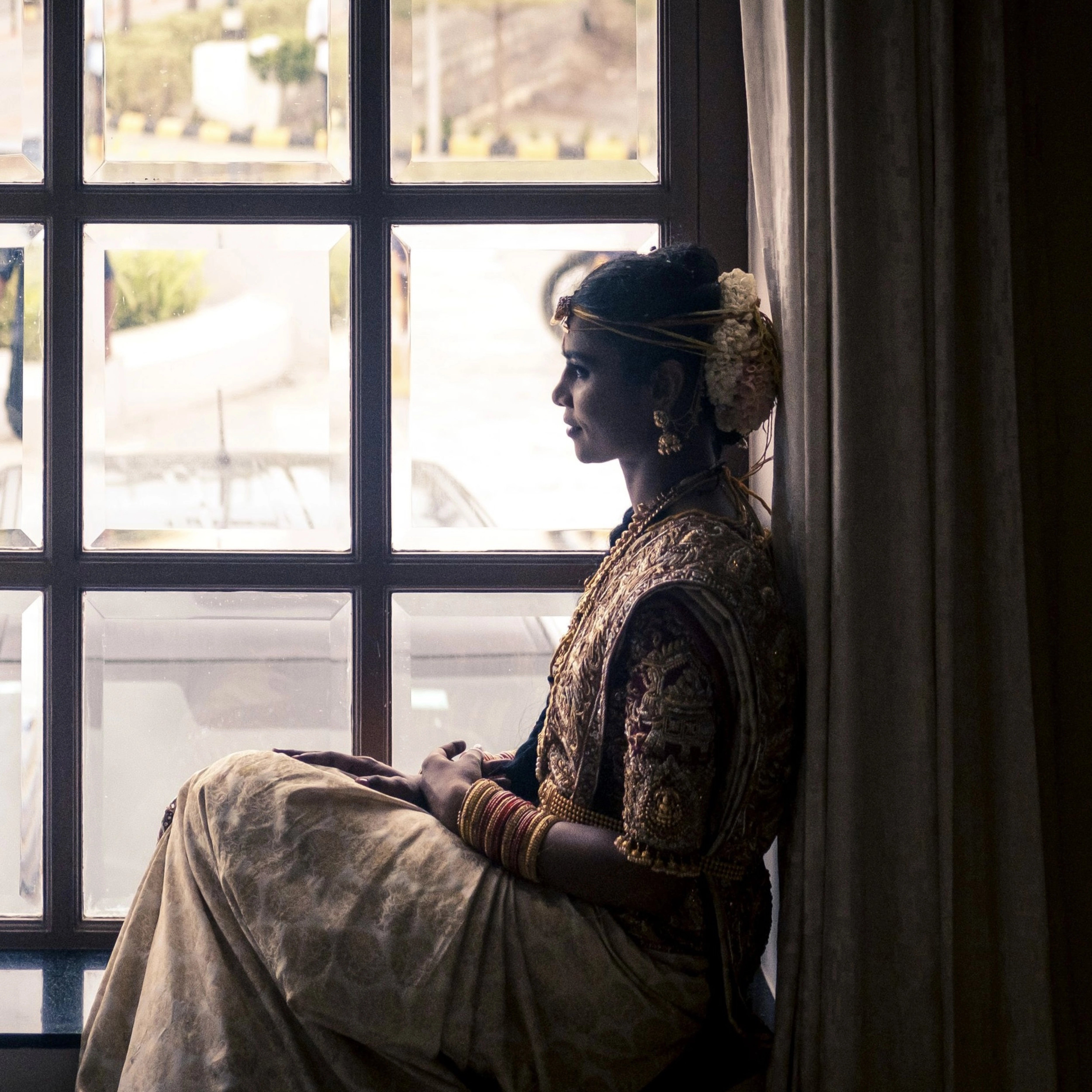 Bride Bhargavi for a photoshoot in a maroon palanquin concept silk blouse and saree border, intricately handcrafted with zardosi, beads, resham work, kundan and sequins by team Archana Karthick.