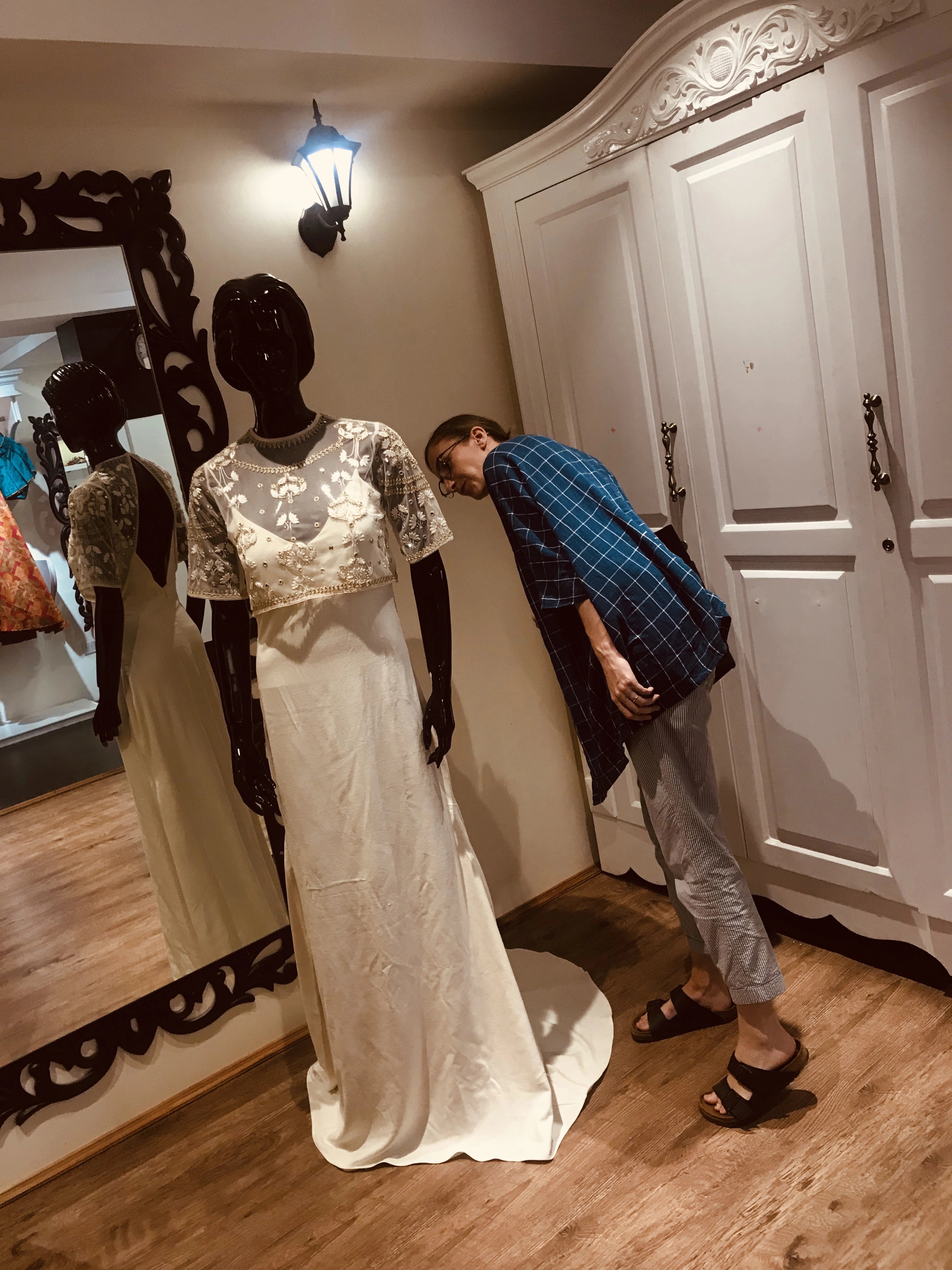 Bride Catriona from Scotland, during her fittings in a white gown for her beach wedding, handcrafted by team Archana Karthick.