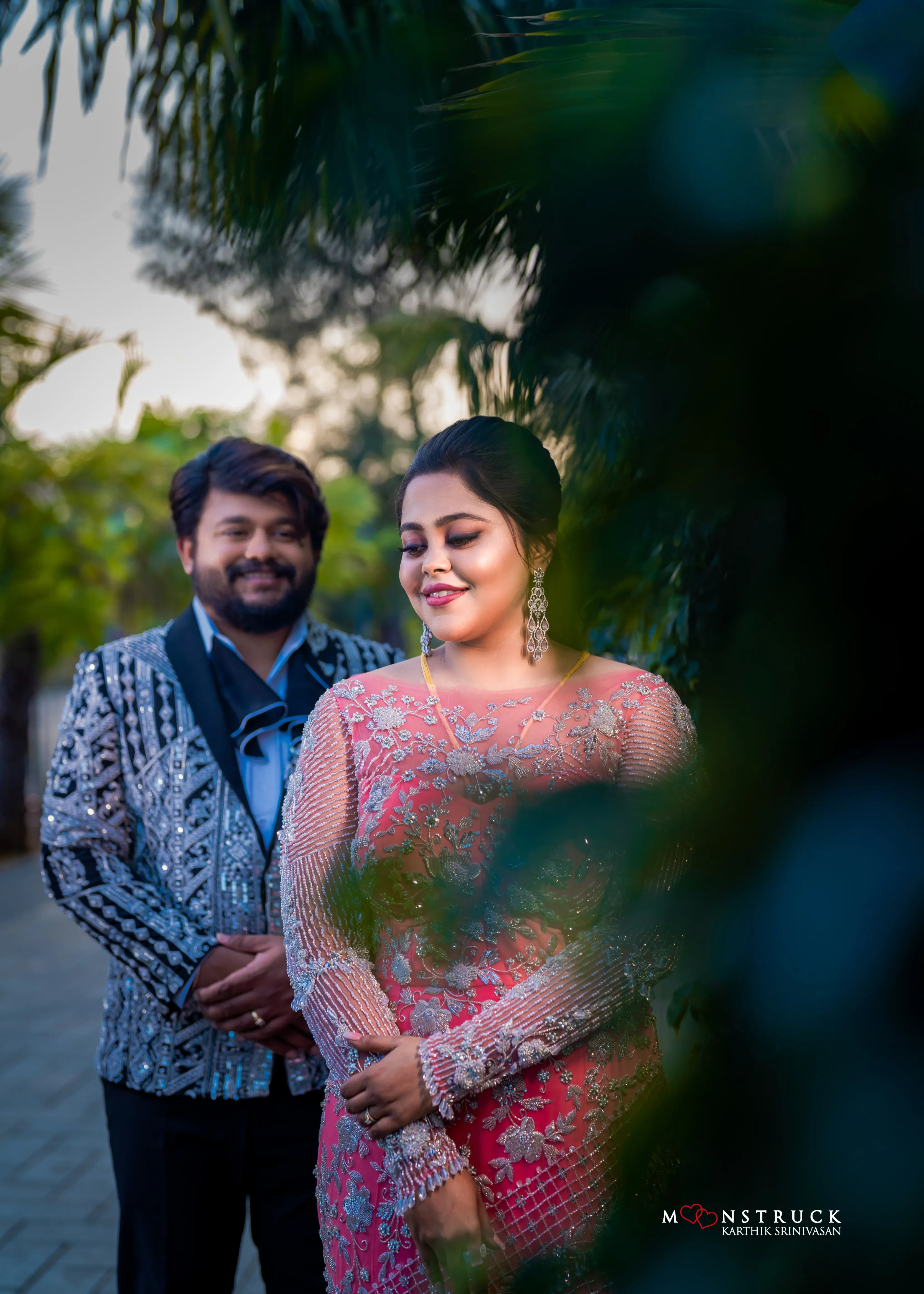 Bride (Coimbatore) in handcrafted pink tulle gown and and Groom (Chennai) in embeliished jacket for their reception.
