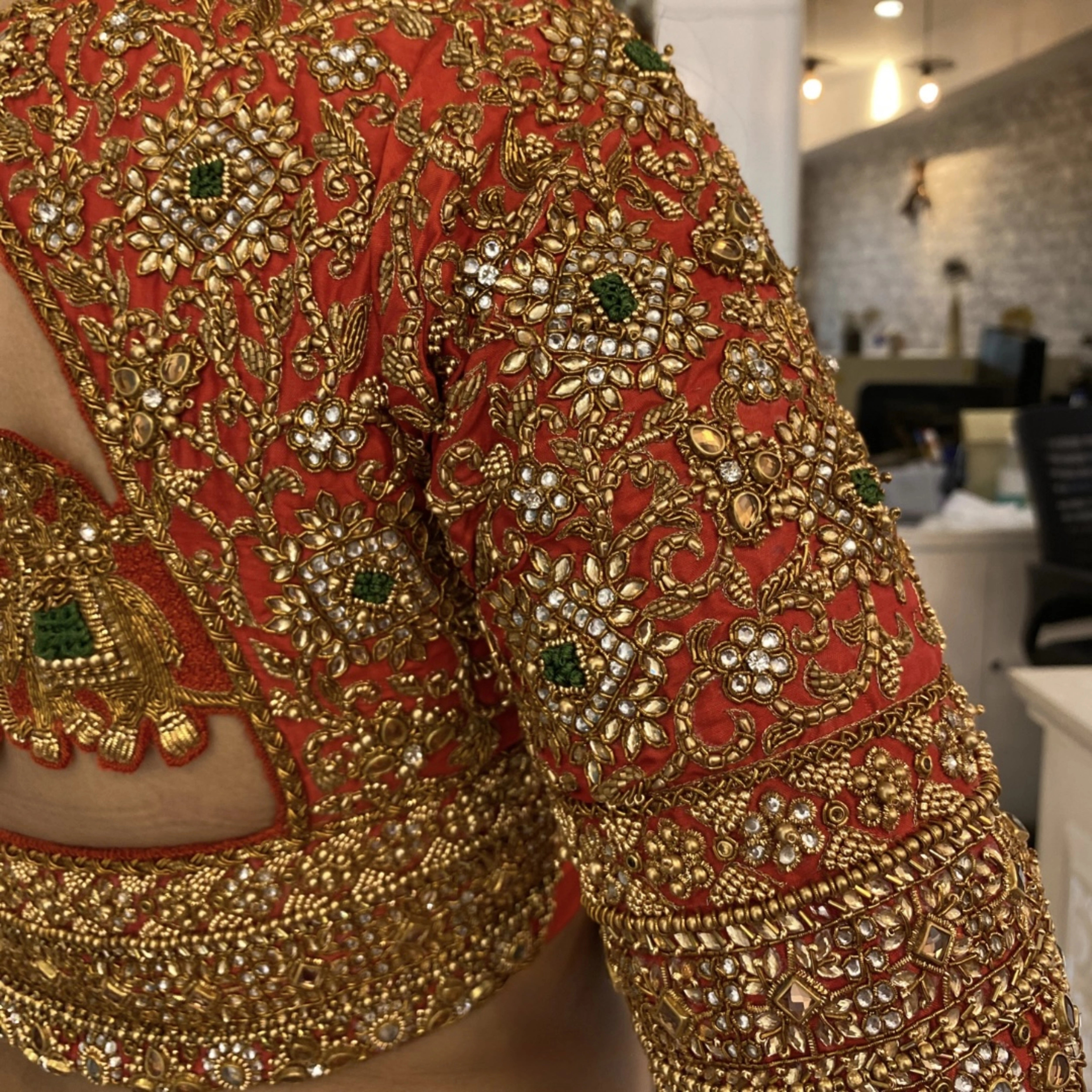 Bride Deepachitra during the fittings for her vermilion silk blouse with the palanquin concept. Intricately handcrafted with stones, resham, zardozi, beads and cutdana by team Archana Karthick.