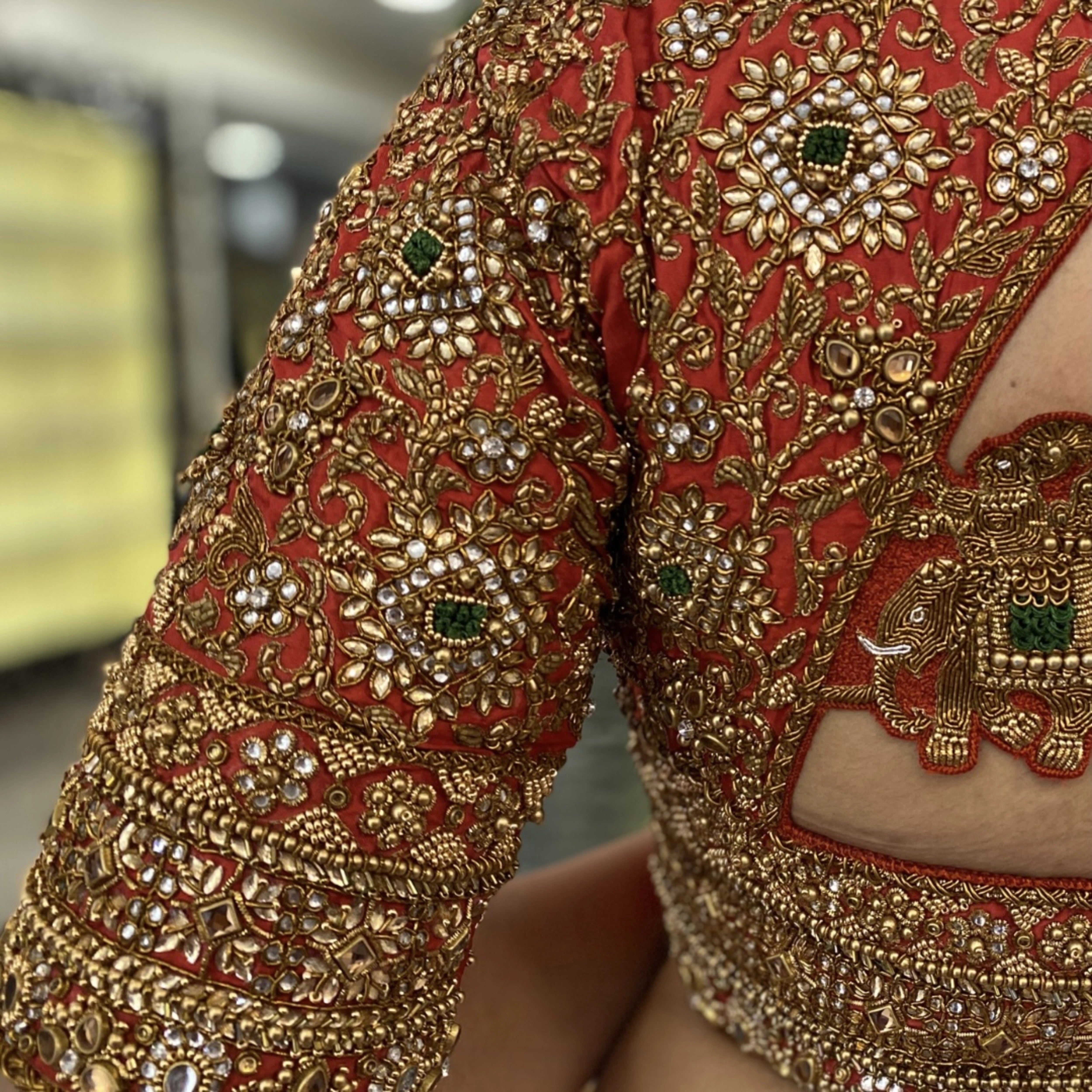 Bride Deepachitra during the fittings session for her vermilion silk blouse with the palanquin concept. Intricately handcrafted with stones, resham, zardozi, beads and cutdana by team Archana Karthick.