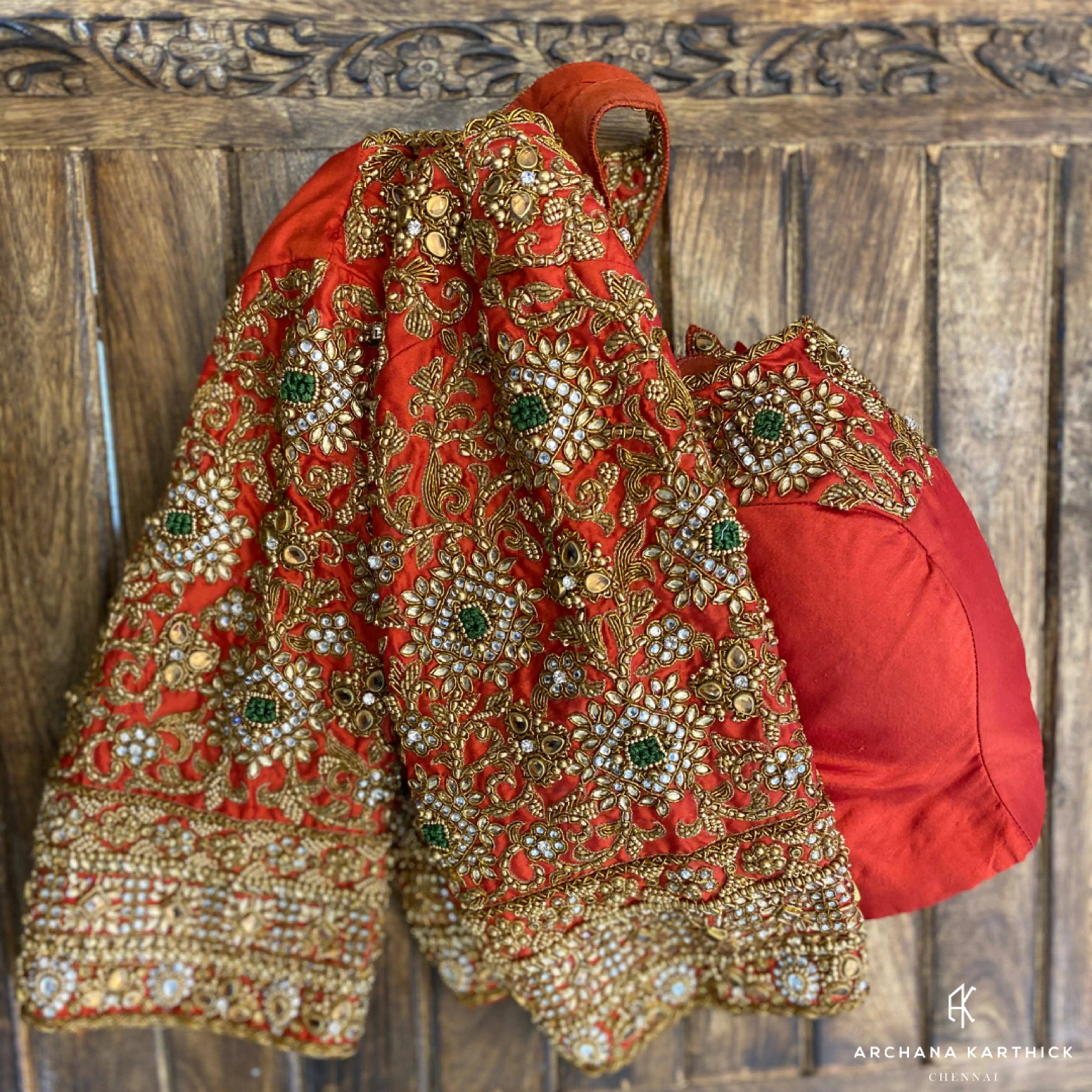 Bride Deepachitra's vermilion silk blouse with the palanquin concept. Intricately handcrafted with stones, resham, zardozi, beads and cutdana by team Archana Karthick.