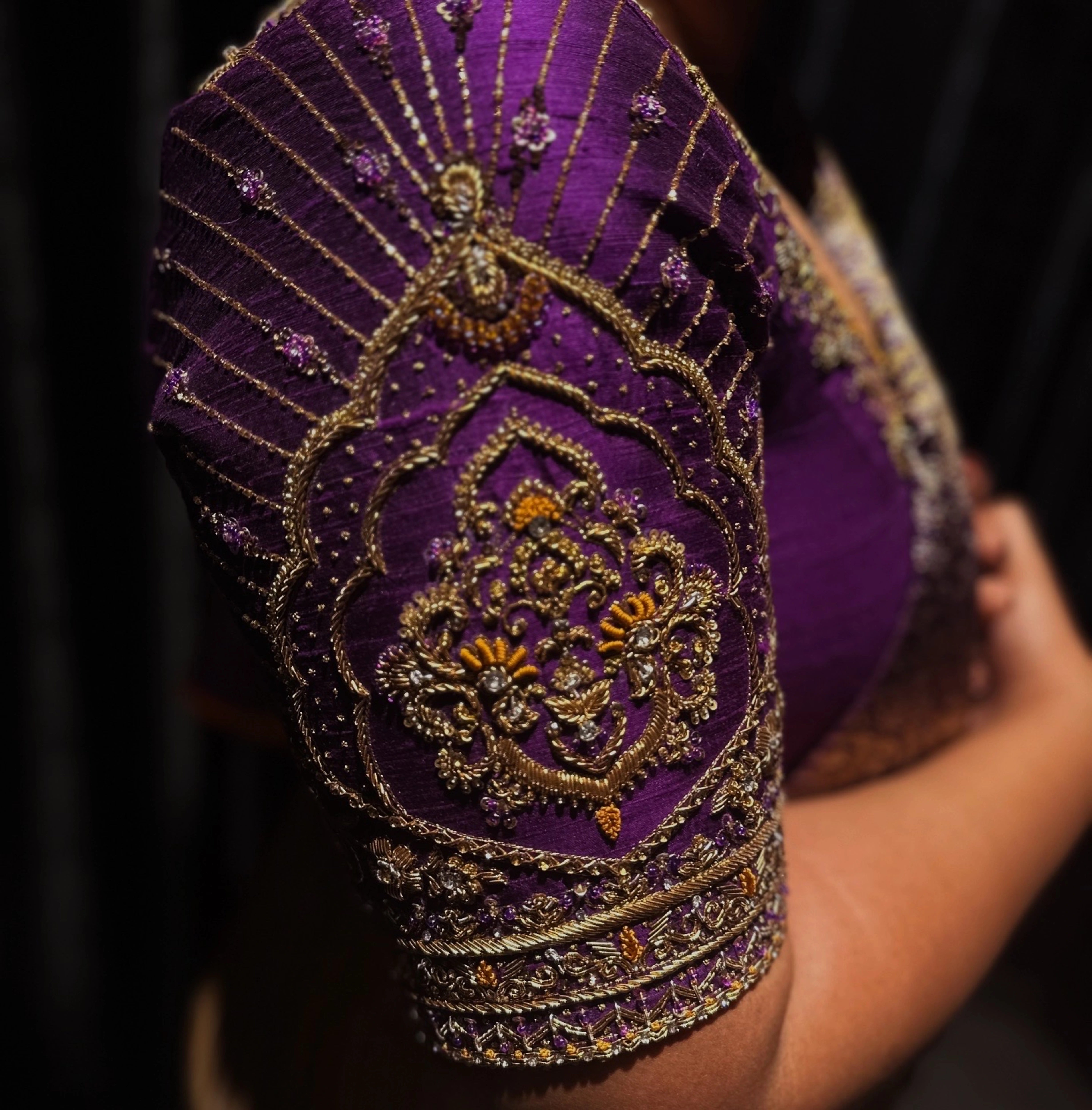 Bride Gayathri posing in a purple silk blouse by team Archana Karthick.