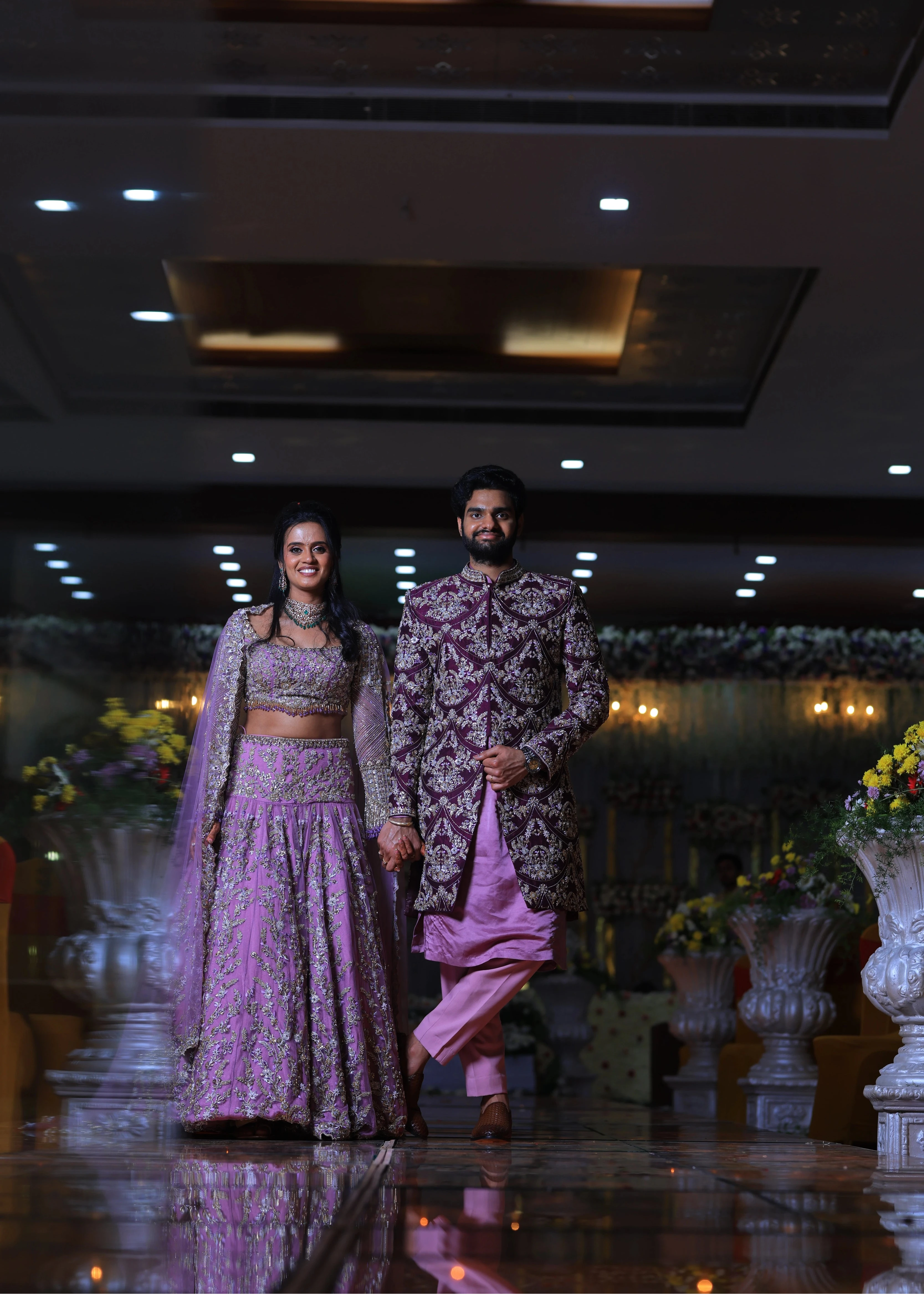 Bride & Groom in lavender raw silk lehenga and sherwani, handcrafted with sequins, cutdana, beads, crystals, rhinestones and zardozi by Archana Karthick