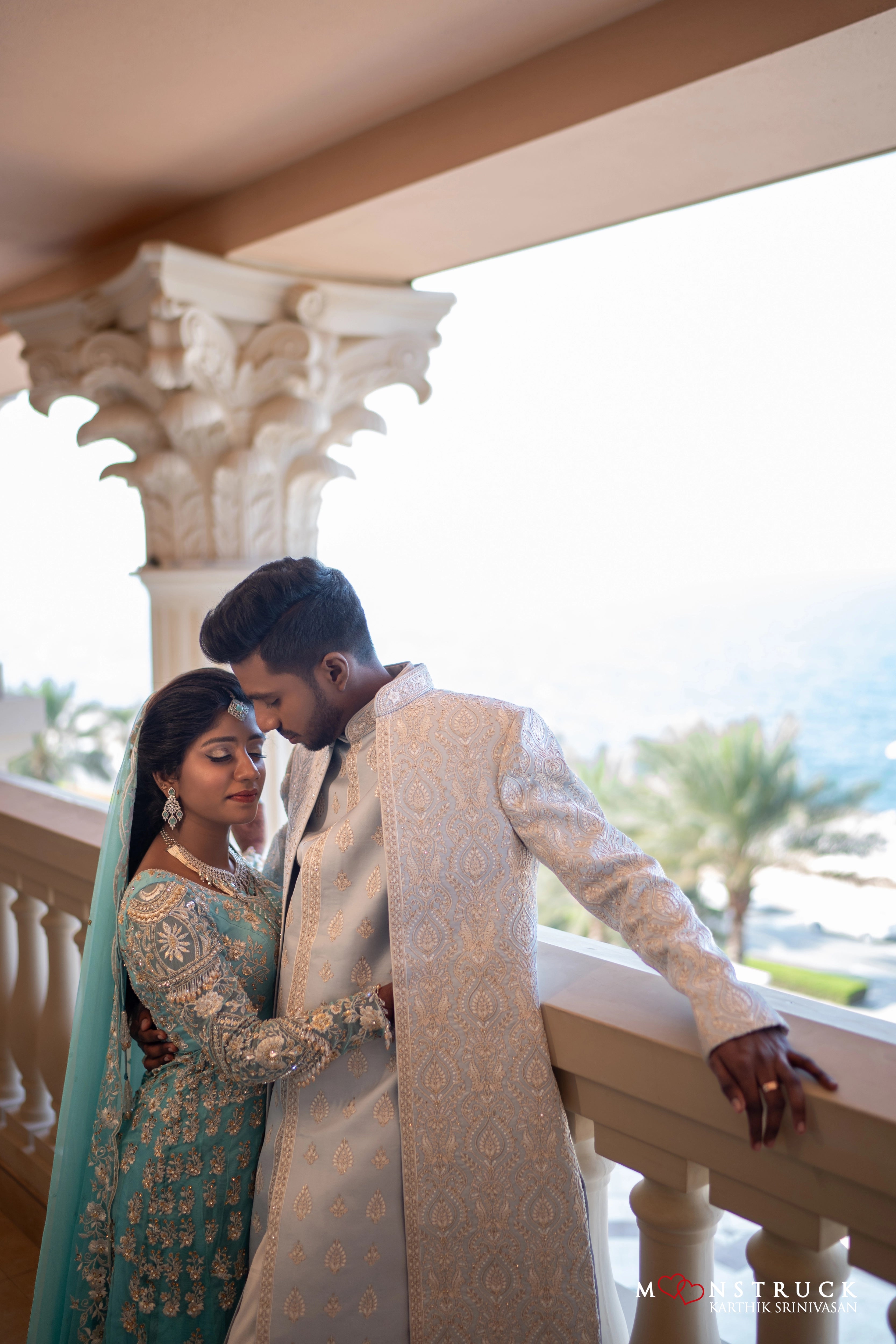 Bride Harsha during photoshoot with groom in a sea green masakali lehenga by Archana Karthick