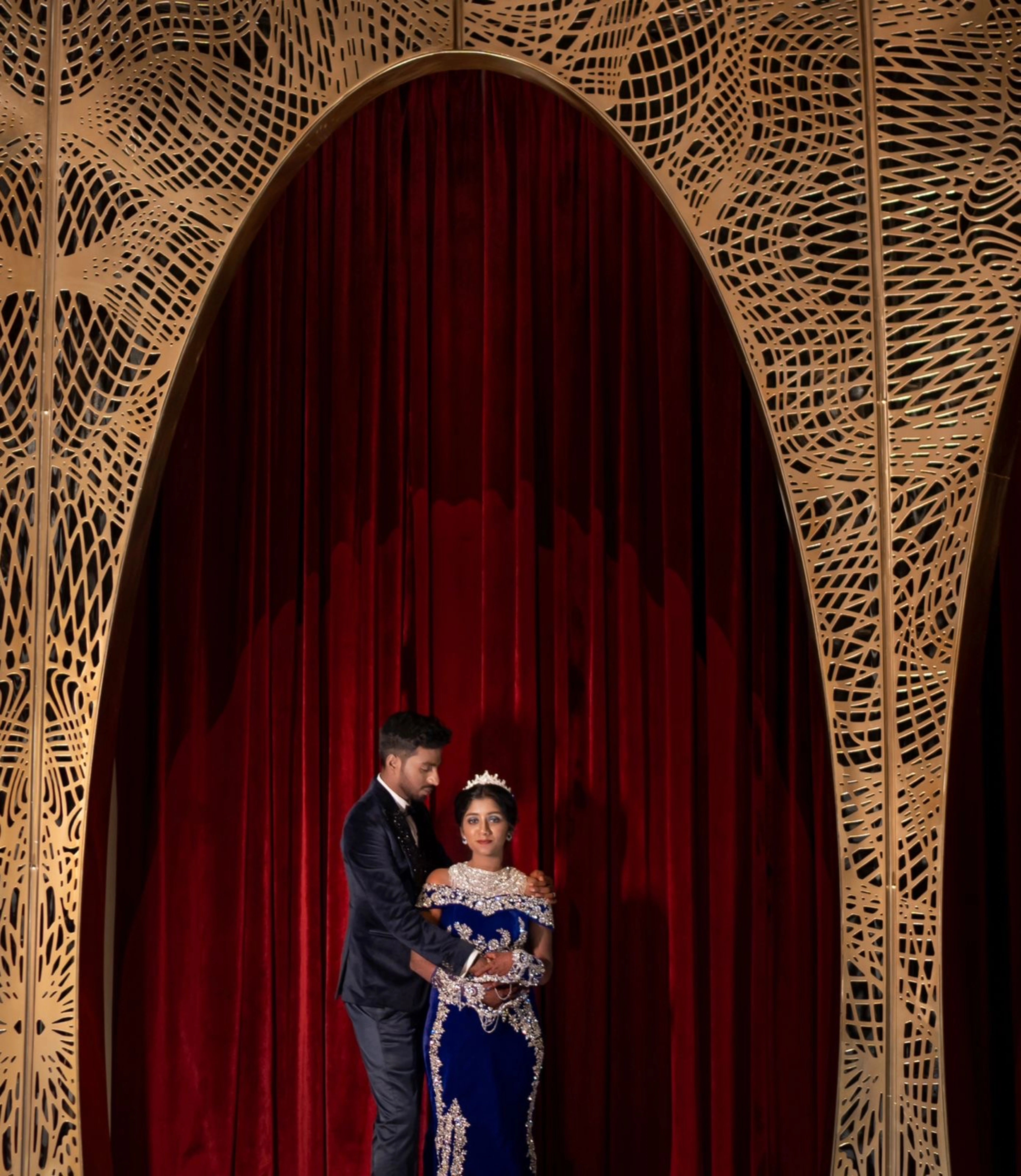 Bride Harsha posing in a blue velvet gown by team Archana Karthick.