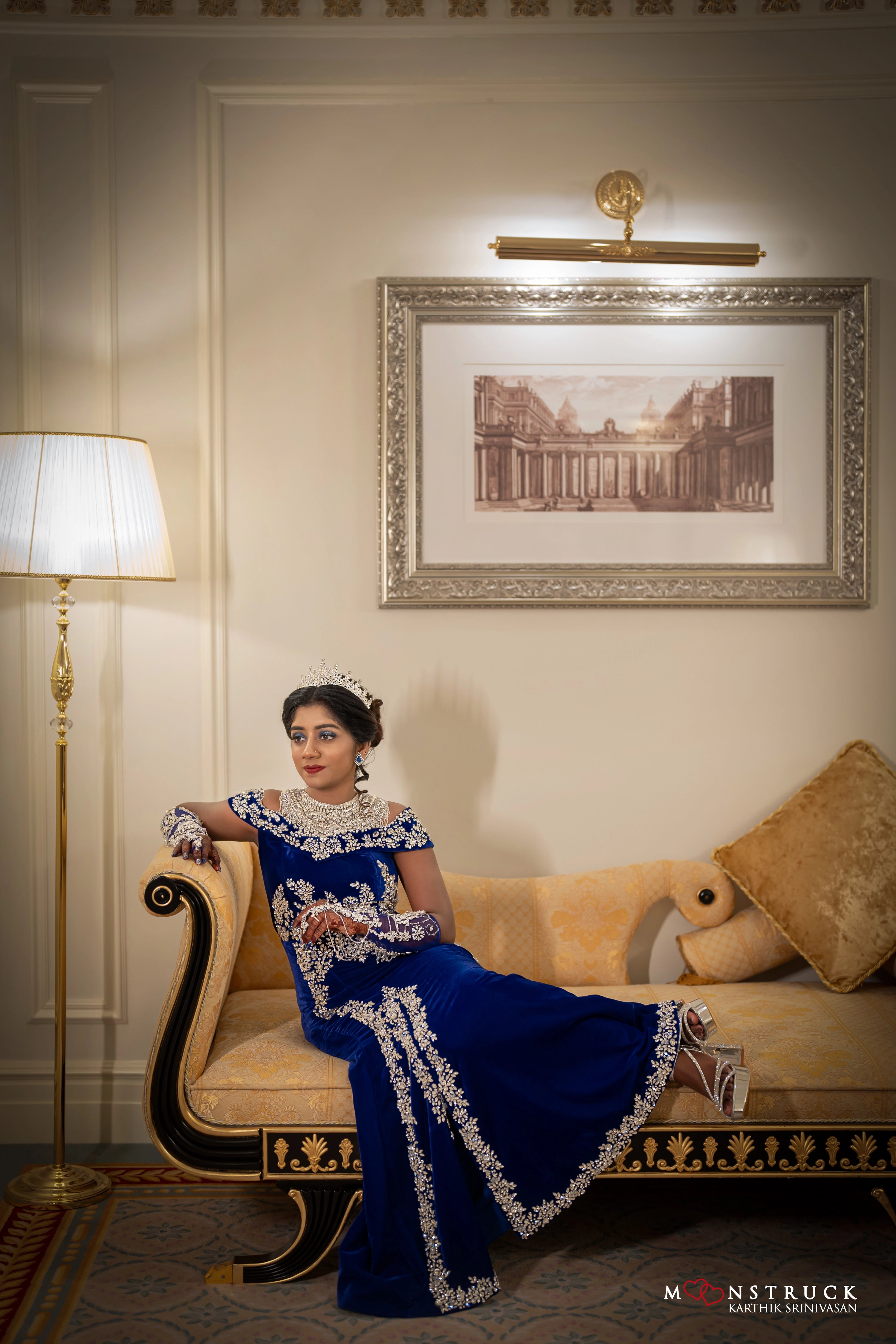 Bride Harsha smiling in a blue velvet gown by team Archana Karthick.
