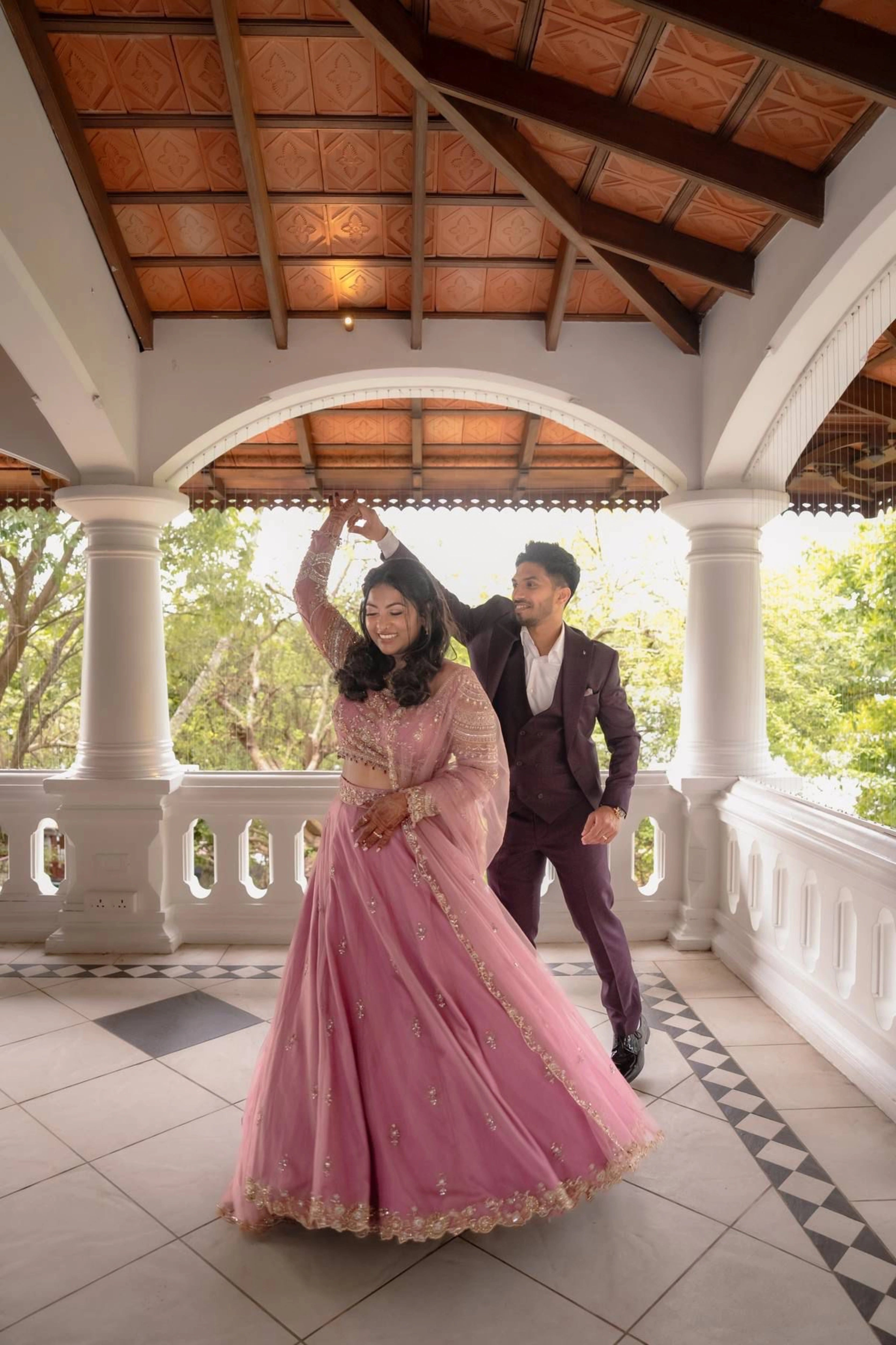 Bride Karoline from Qatar twirling in a lilac tulle lehenga by team Archana Karthick.