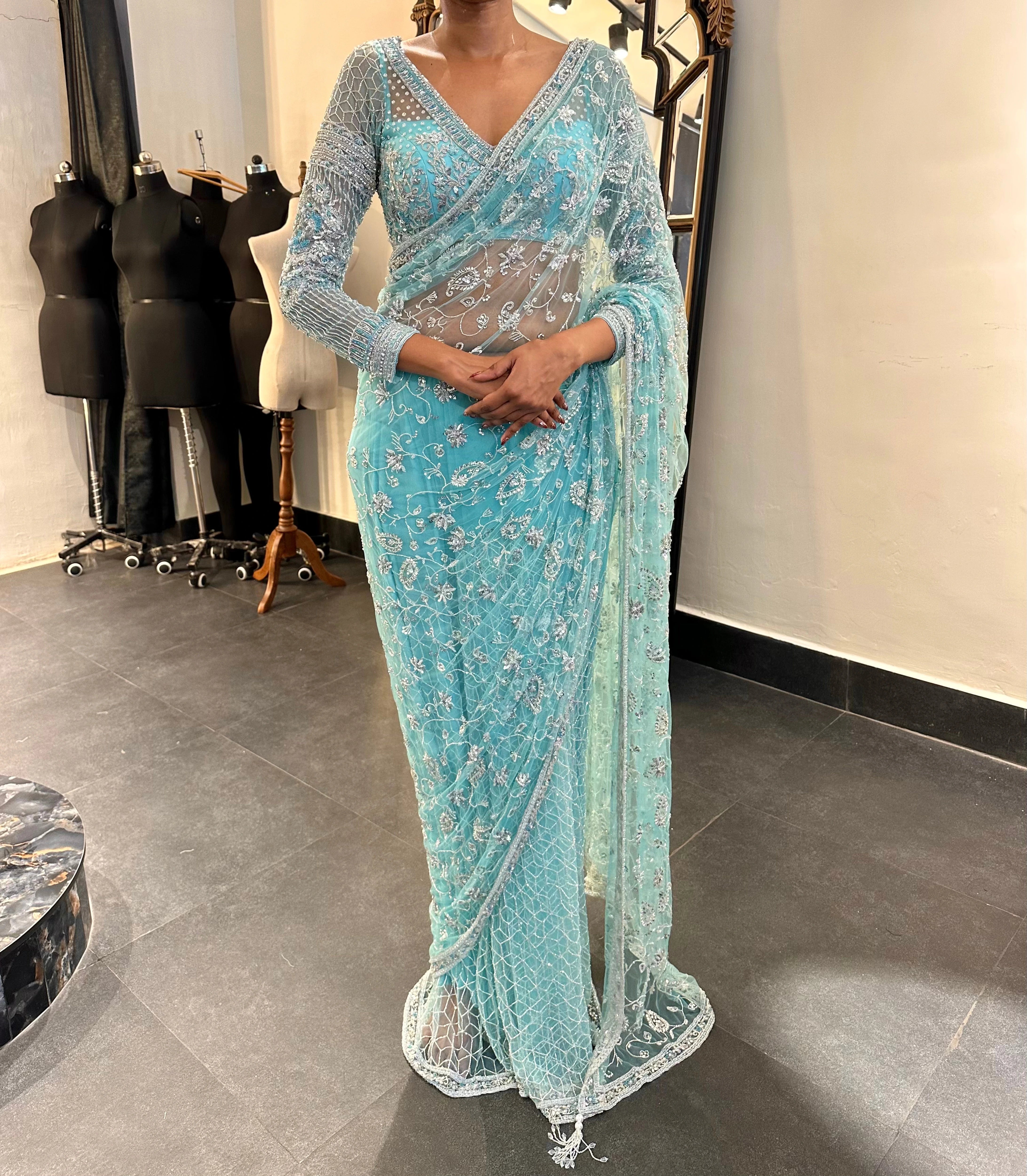 Bride Krithi from USA in a blue tulle saree, handcrafted by team Archana Karthick.